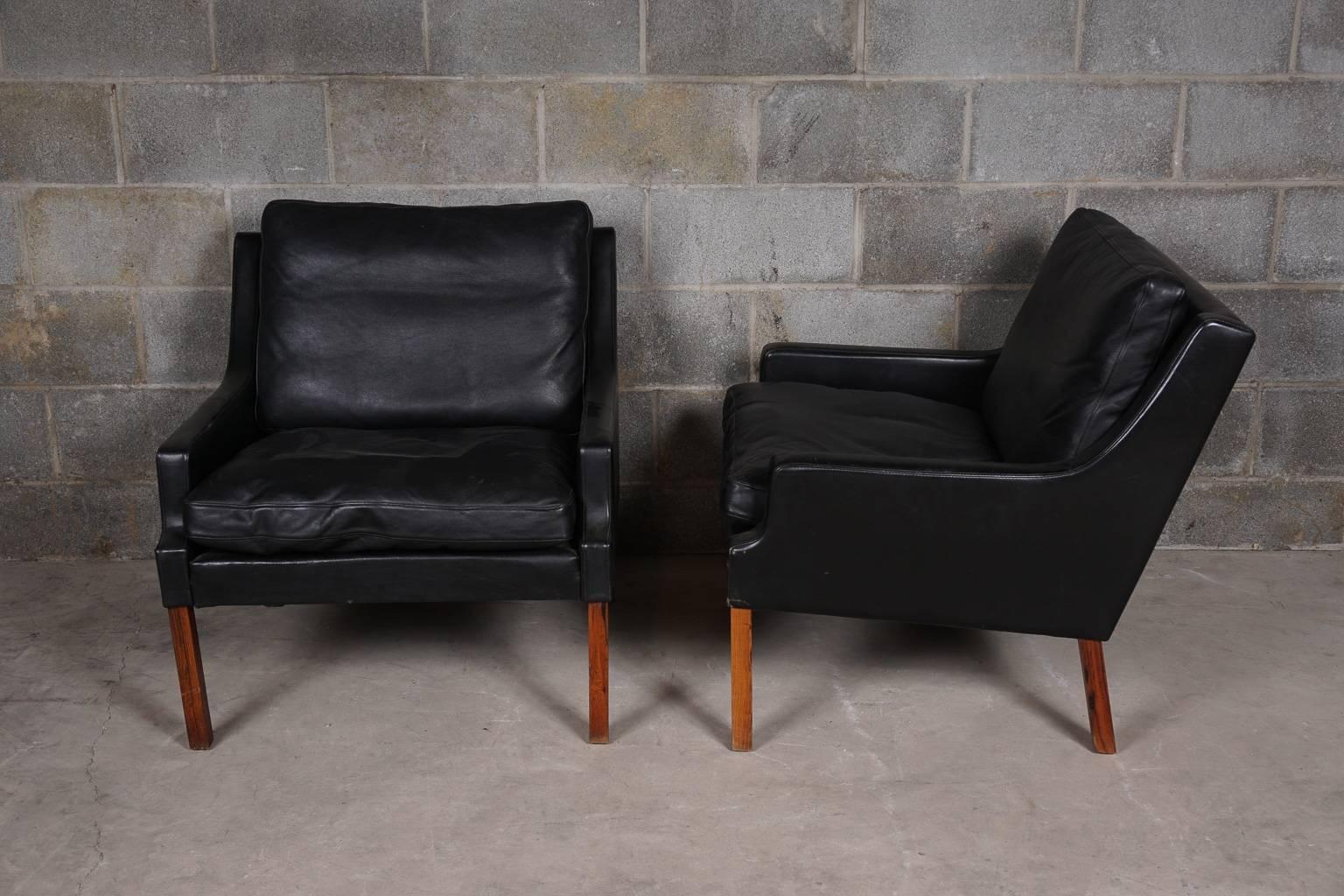 Pair of black leather chairs deigned by Rud Thygesen, manufactured by Vejan, Denmark.