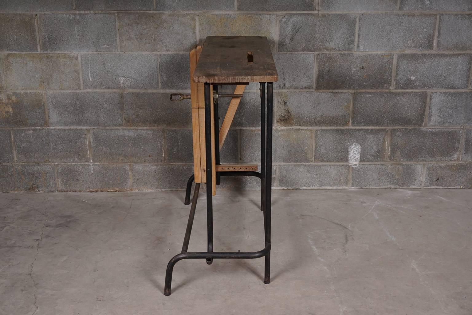 Vintage industrial console table, France, 1940s. Solid oak top with a metal base. Nice wear and patina.