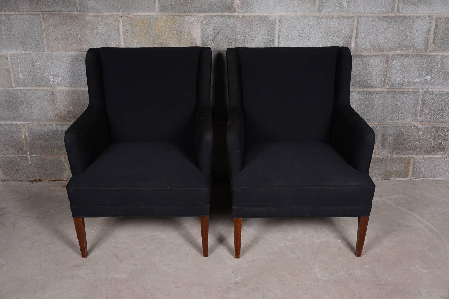 Pair of Frits Henningsen chairs upholstered in black fabric. Tapered stained beech legs. Very good quality and design.