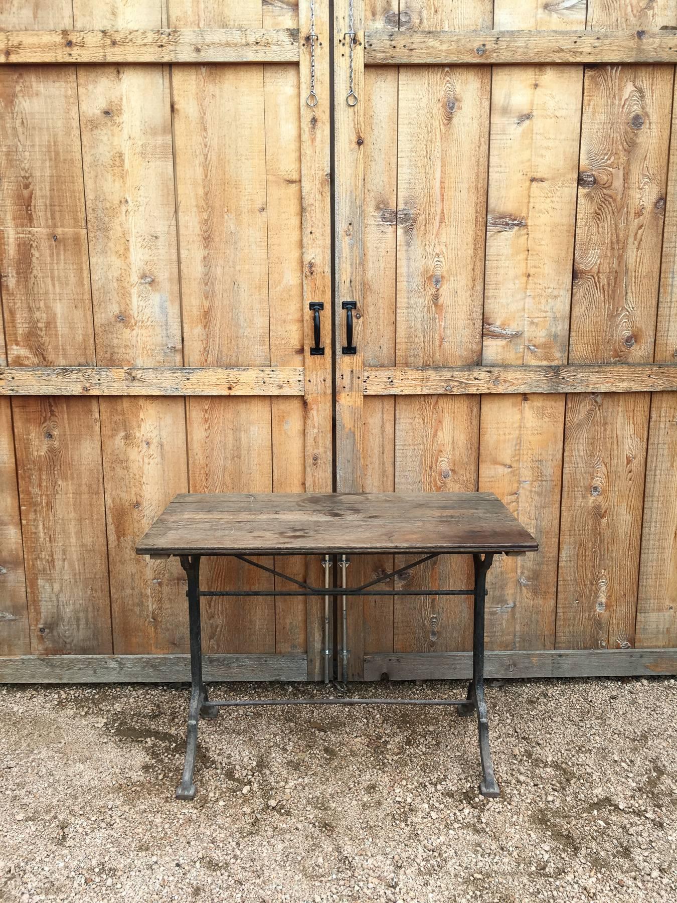 French bistro table. Oak top on metal base.