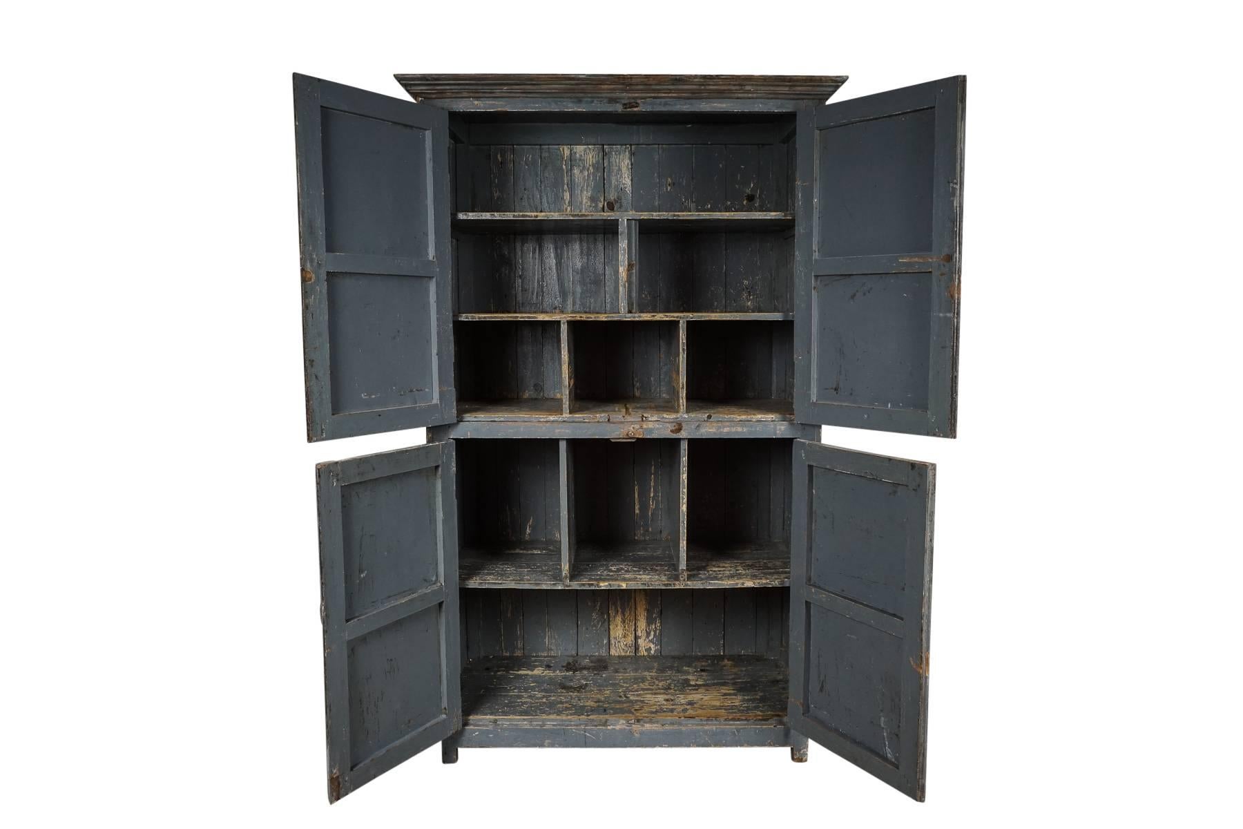 French four-door cabinet in original blue color with a fantastic patina. Wood and metal doors with original closures.