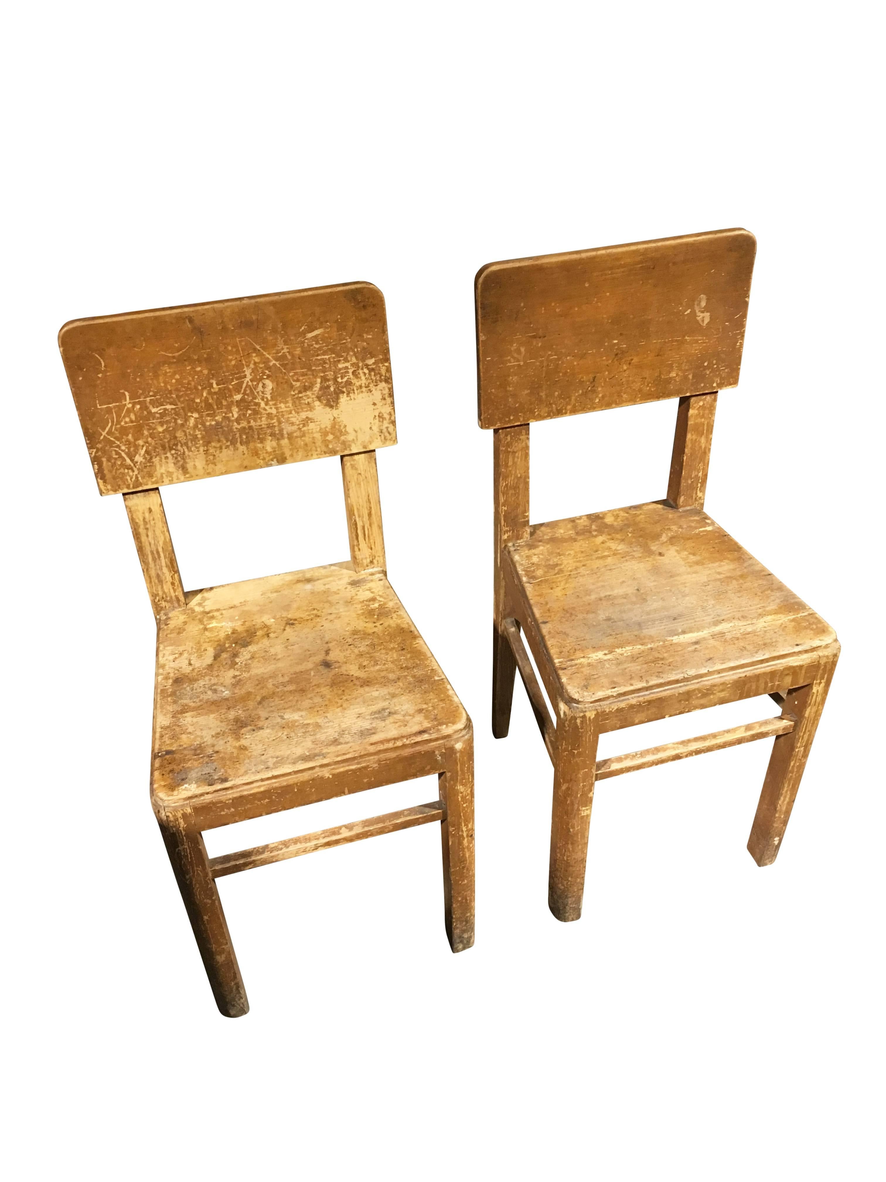 Pair of Primitive wooden chairs from Belgium in original color.
