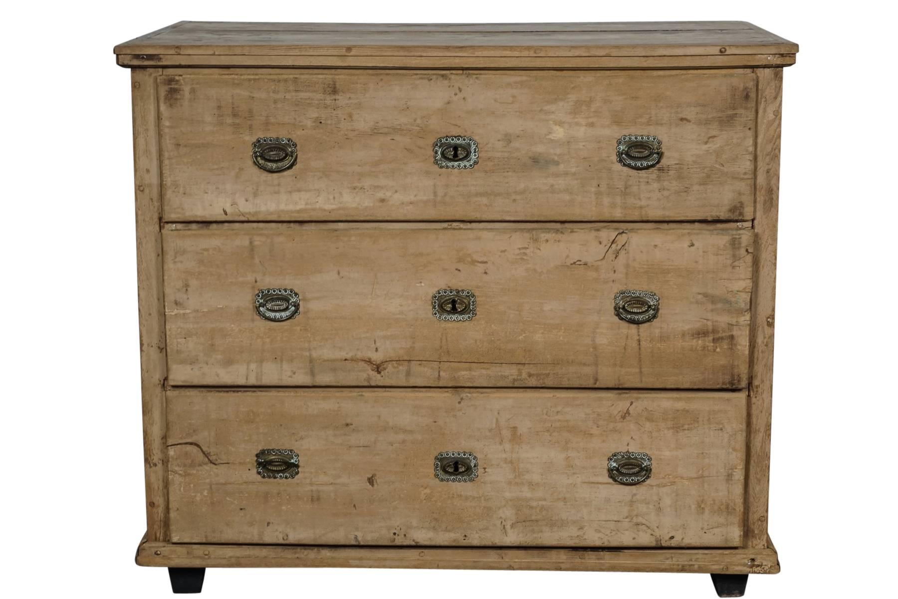Belgian chest of drawers with original surface, circa 1890. Pine construction with three drawers and original hardware.
