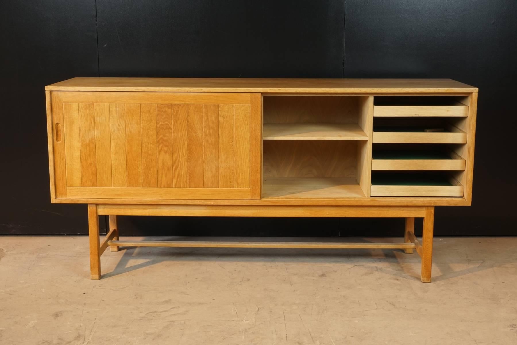 Kurt Ostervig oak credenza for KP Mobler, circa 1970. Two sliding doors with four drawers and two shelves. Rare design and superb Danish quality.