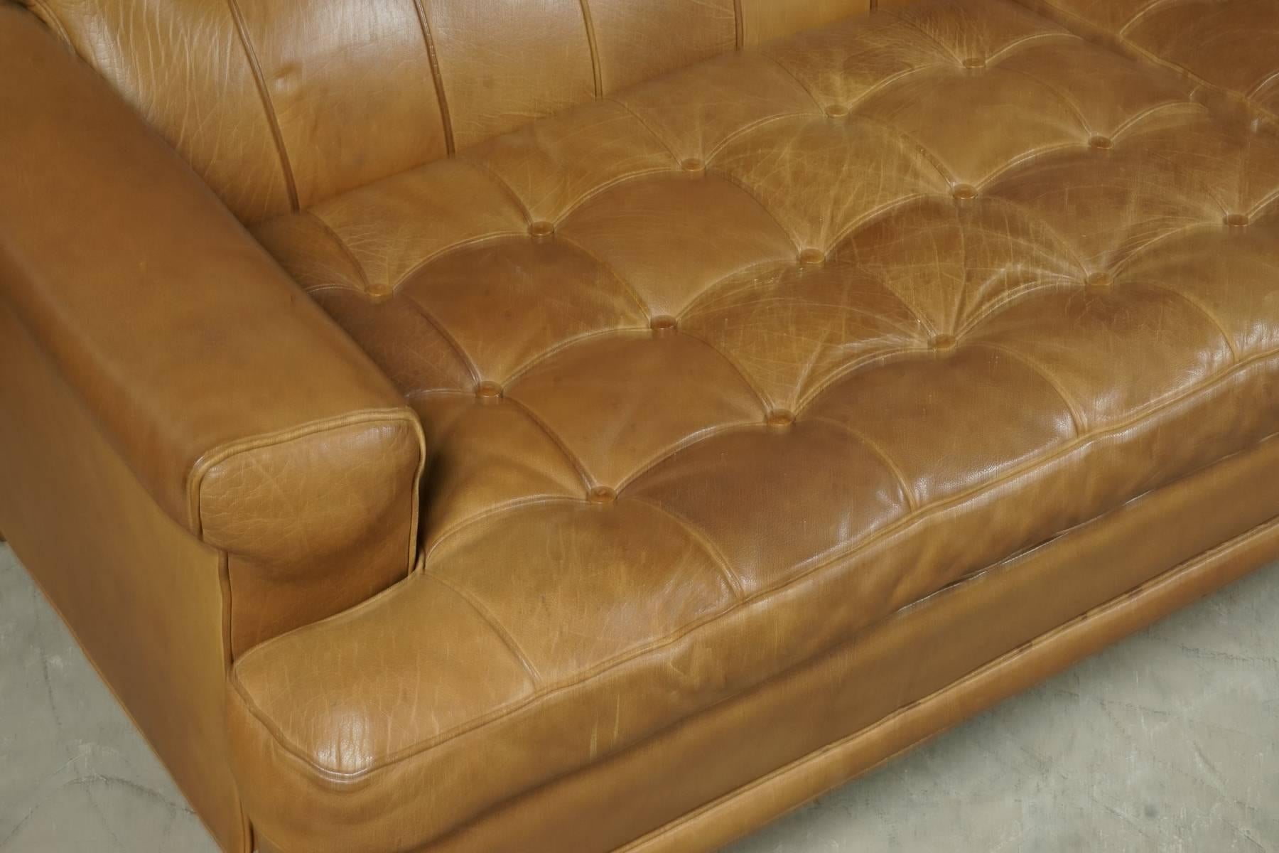 Arne Norell sofa model "Merkur" by Arne Norell AB, Sweden. Superb patina and quality. Buttoned cognac leather covers.