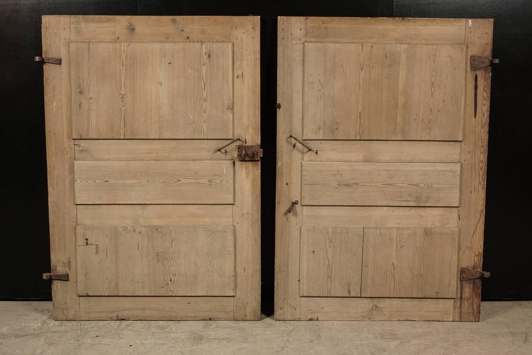 Pair of Primitive doors from Sweden, circa 1820. Solid pine doors with original hardware.