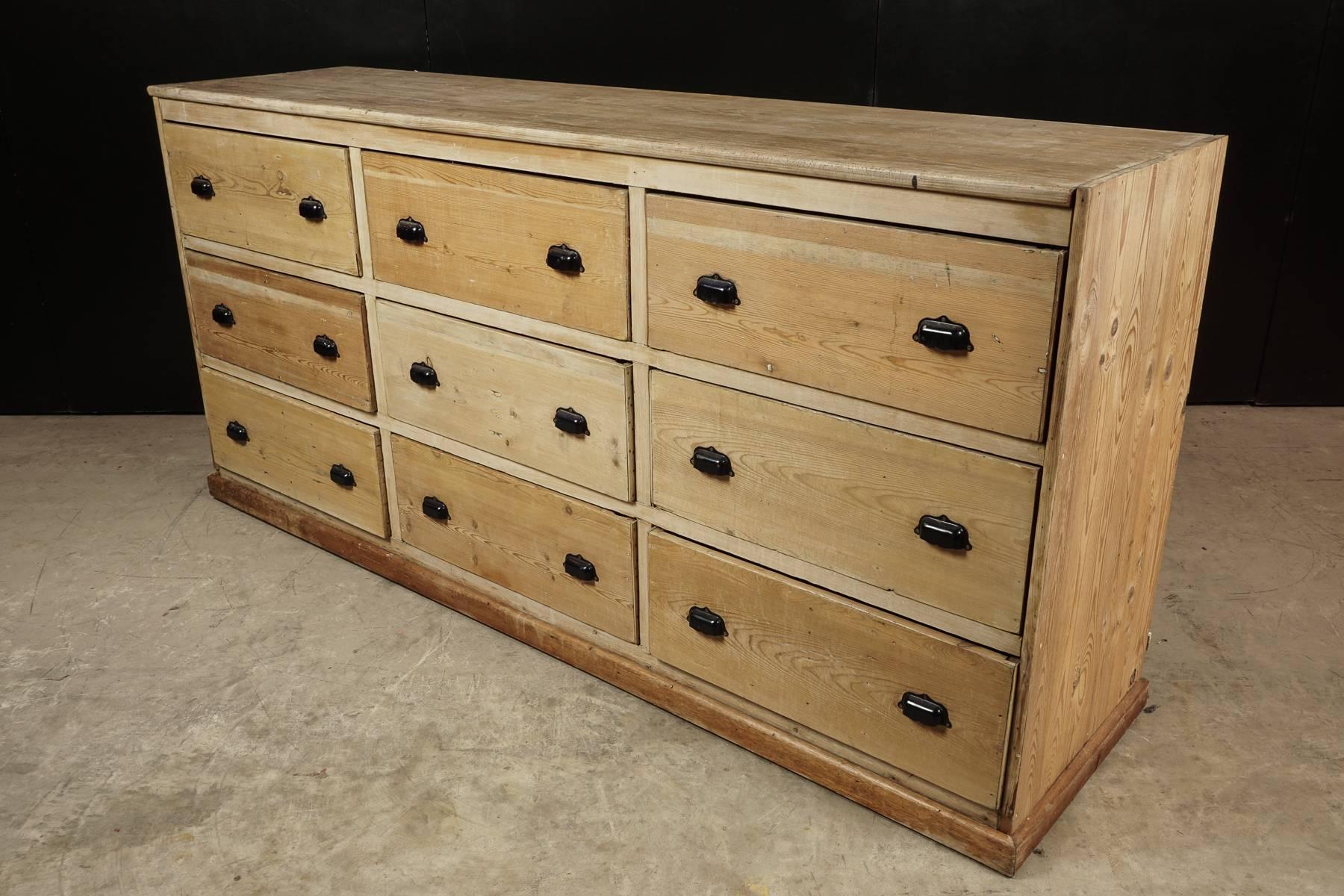 Large pine shop cabinet from France, circa 1920. Nine drawers with original hardware.