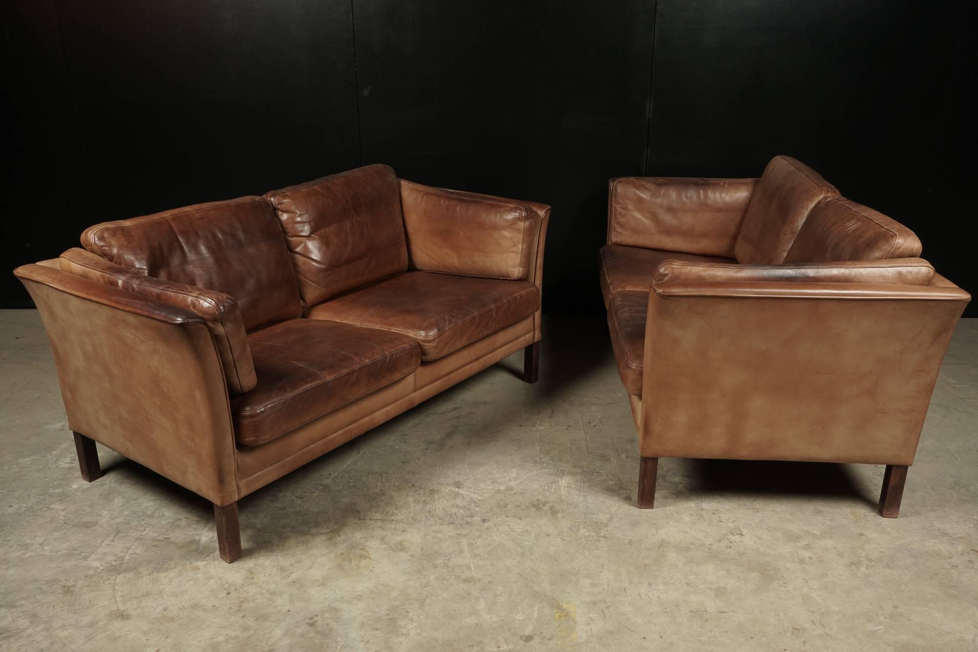 Pair of Two-Seater Leather Sofas From Denmark, Circa 1970.  Original brown leather  with patina.
