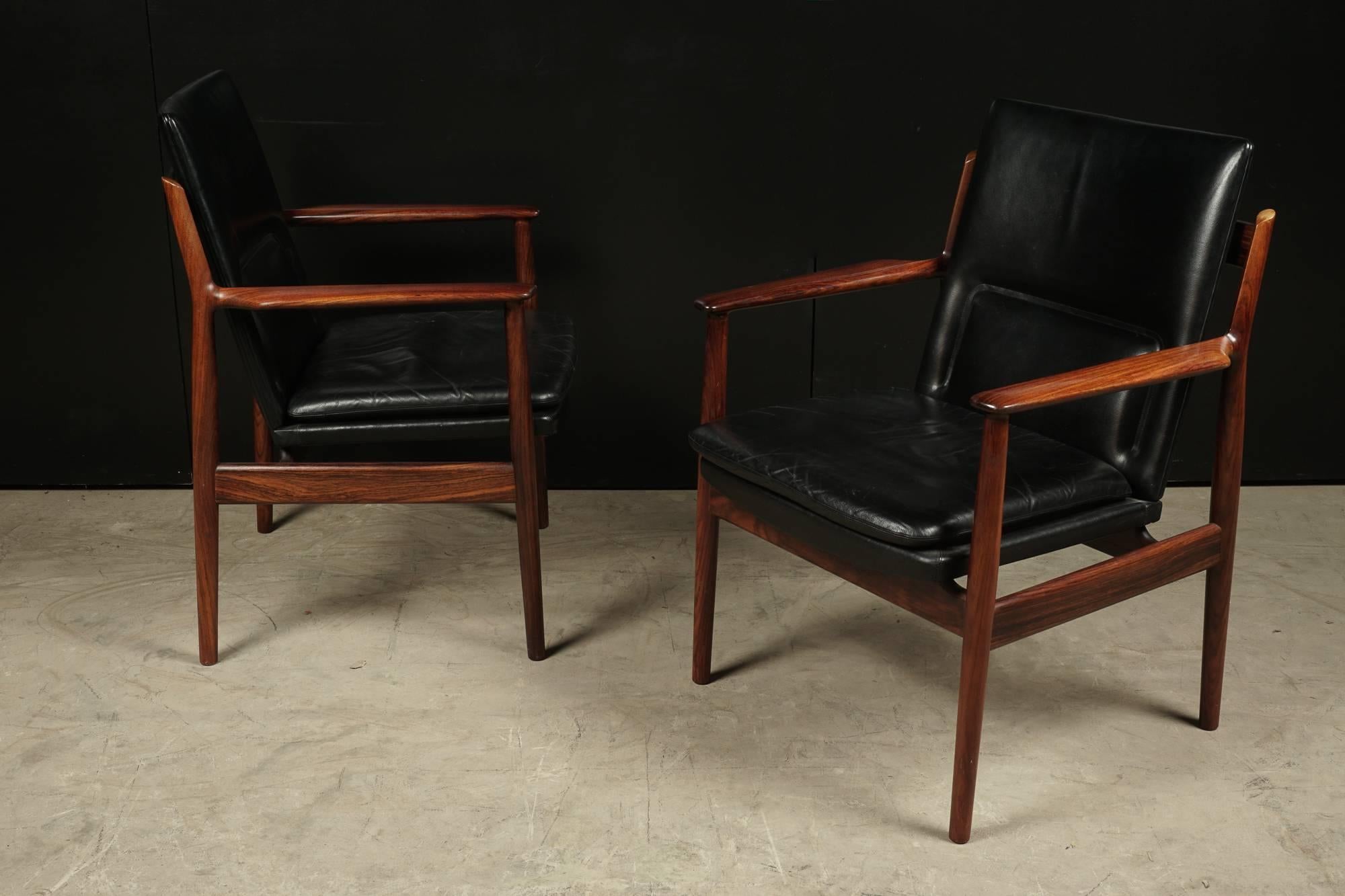 Pair of Lounge Chairs From Denmark, Designed by Arne Vodder, Circa 1960.  Black leather upholstery with a rosewood frame.  Model 431.