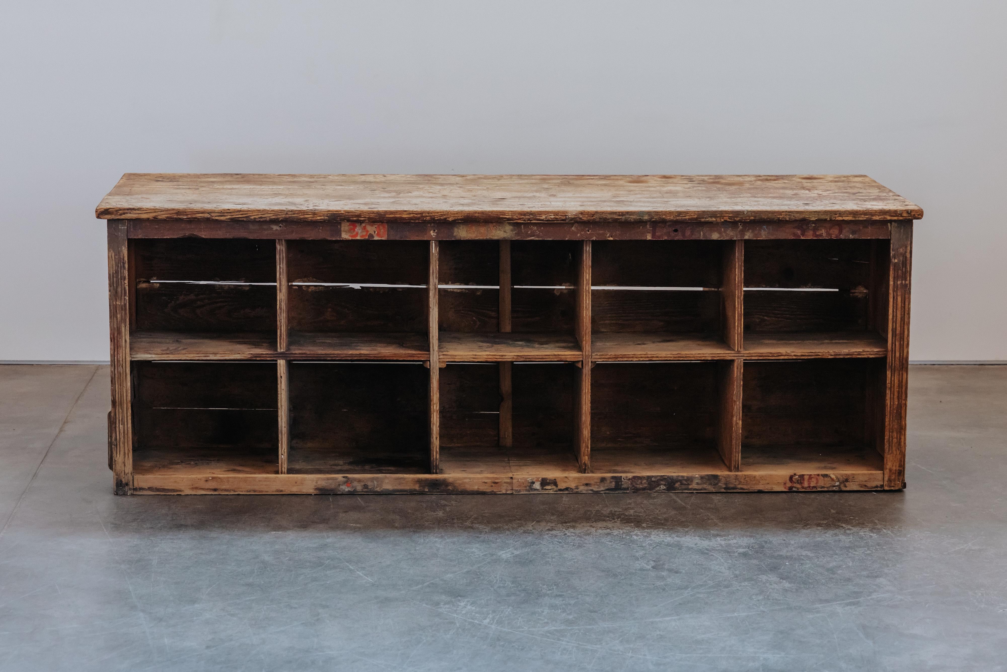 Antique Shop Display Table From Italy, Circa 1920. Solid pine construction with double sided cubbies. Nice original patina and wear. 