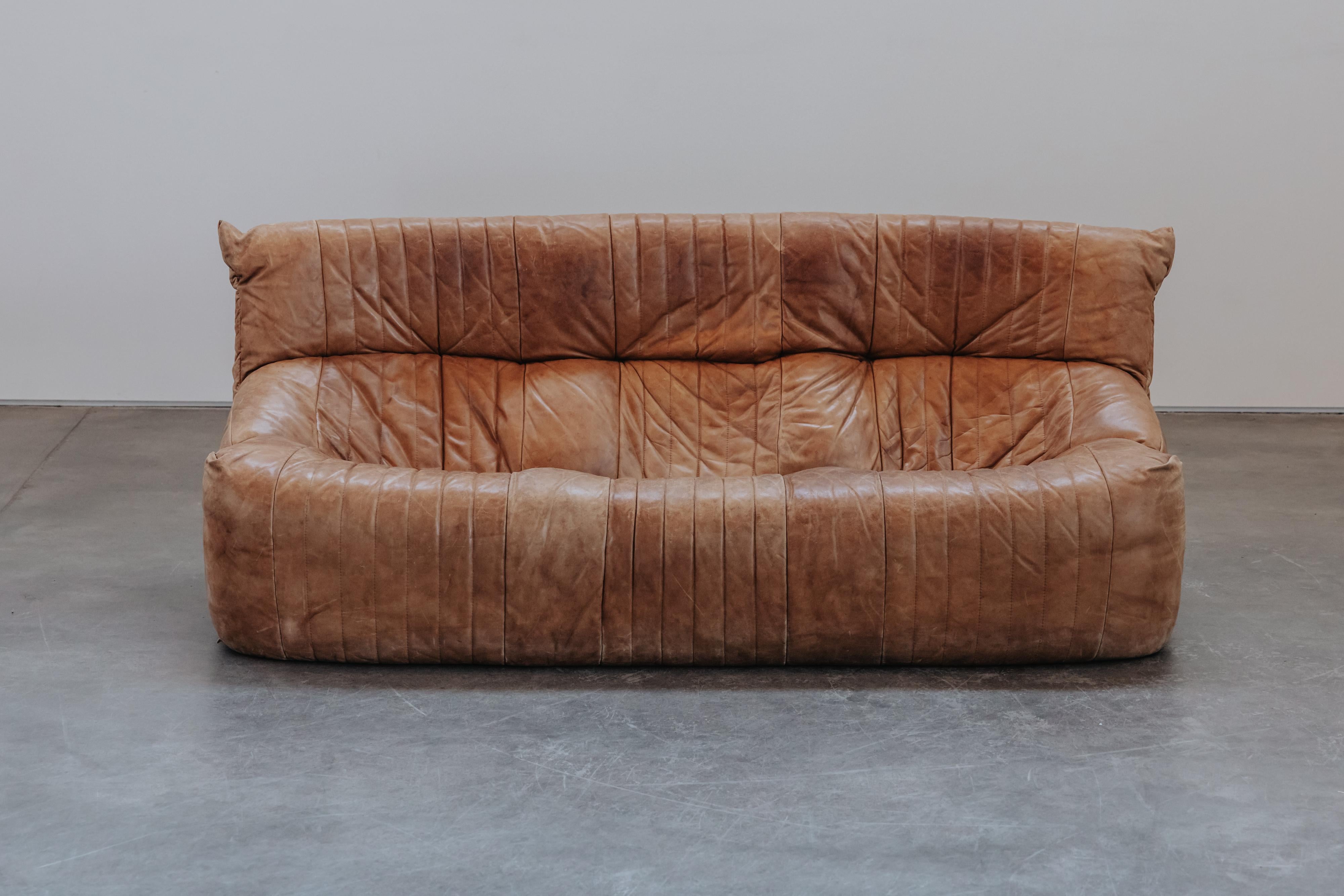Vintage Leather Ligne Roset Sofa, Model Arelia, Circa 1970. Original cognac leather upholstery with fantastic patina and use. 