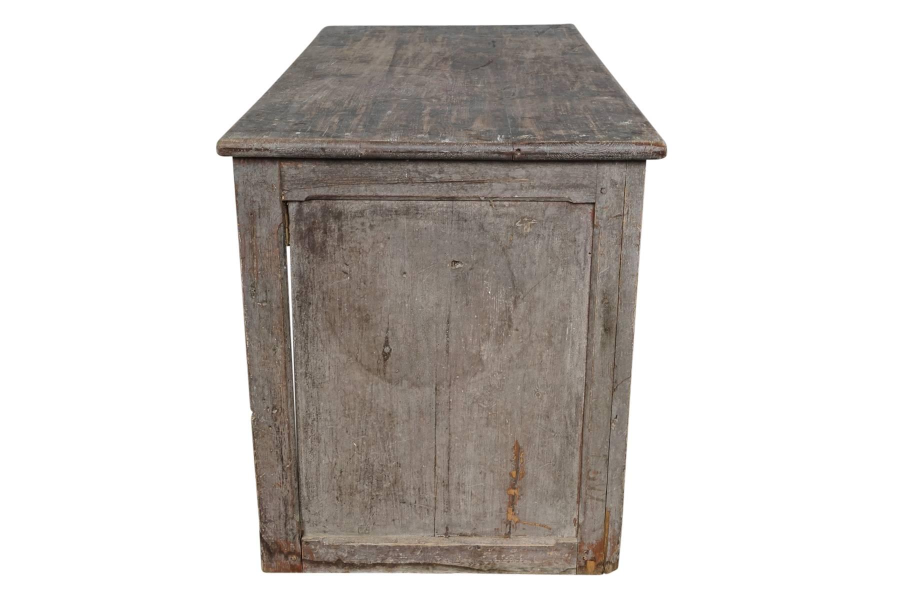 Primitive French counter in original paint. Great color and wear. Two drawers on reverse.