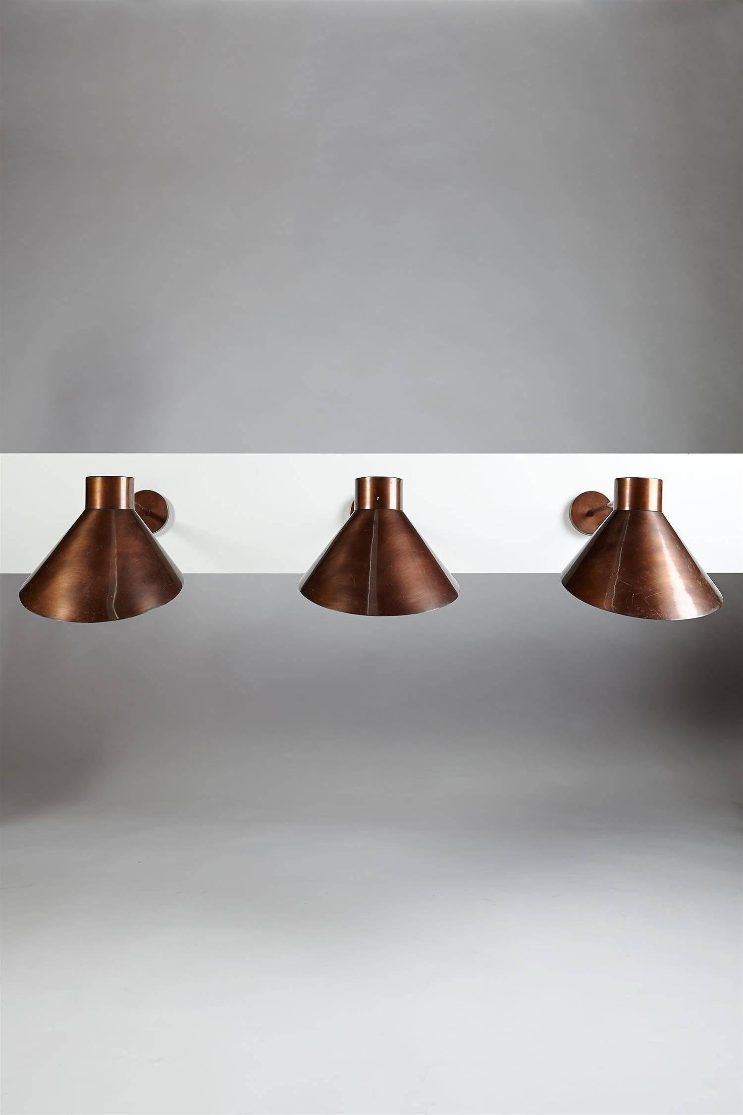 Rare set of three wall lamps in burnished copper.

