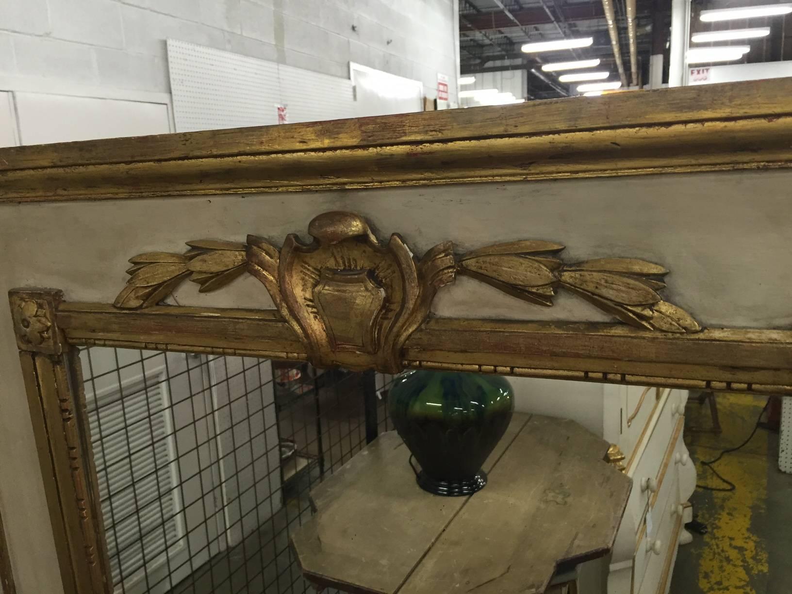 Beautiful French trumeau mirror with original paint and gilt decoration.