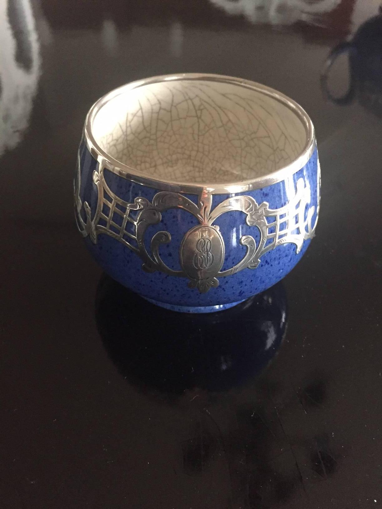 A beautiful porcelain lapis blue with silver overlay tea service. Measures: The creamer is 3.5