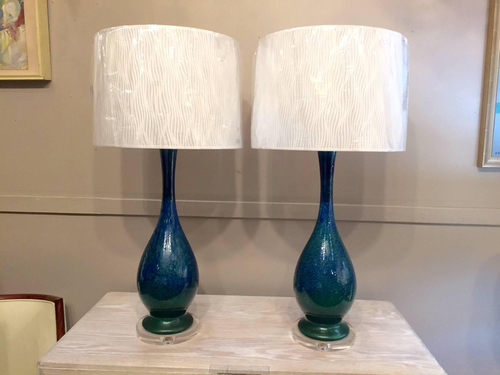 Pair of blue and green glazed lamps with new Lucite bases.