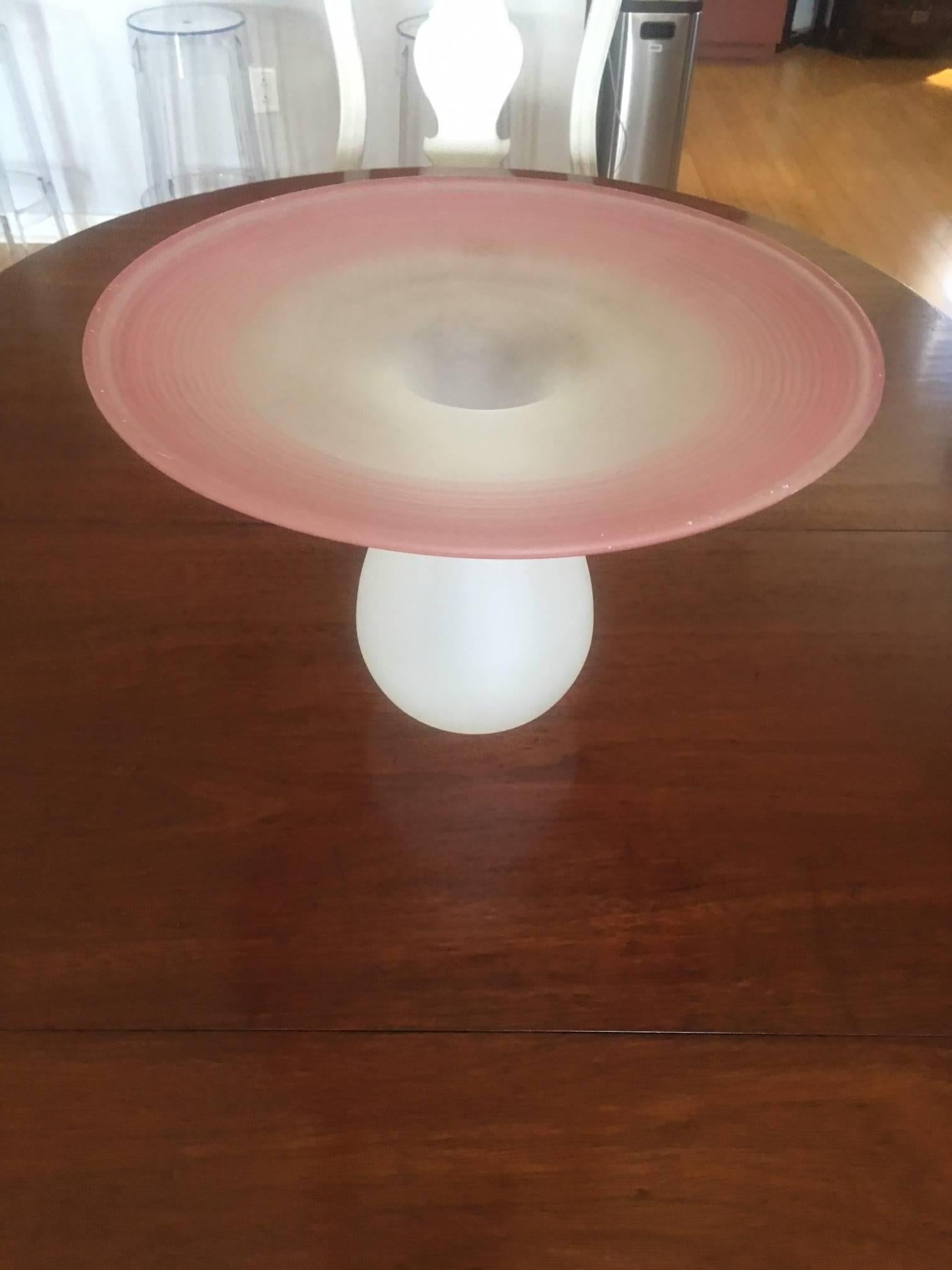 Frosted glass vase with pink swirl rim.