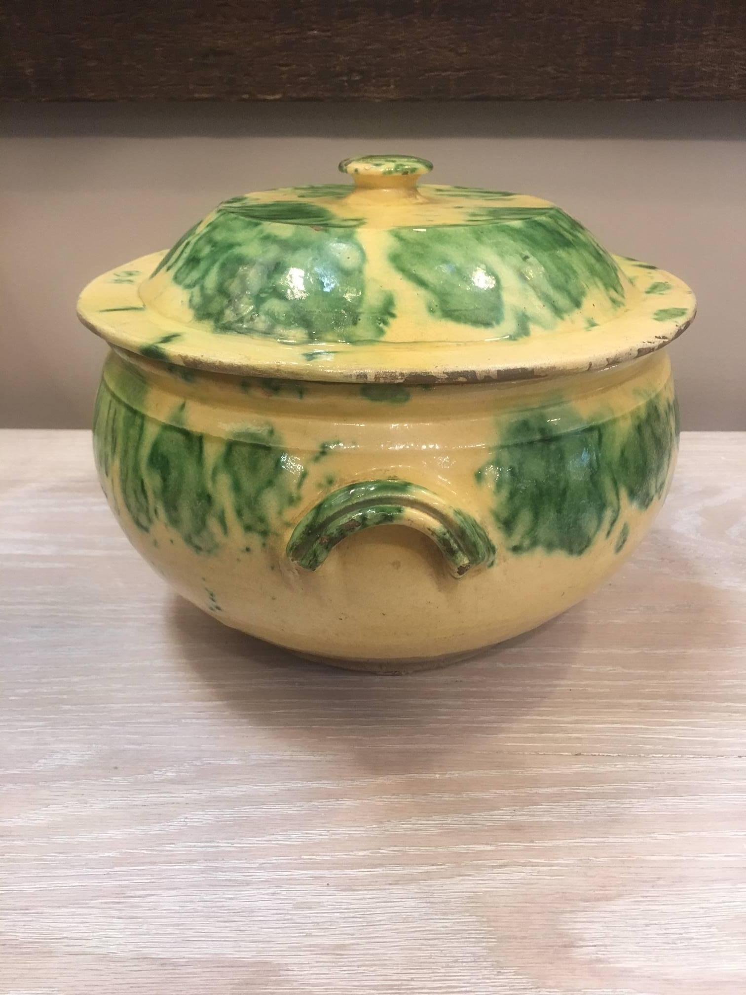 Yellow tureen with green pattern.