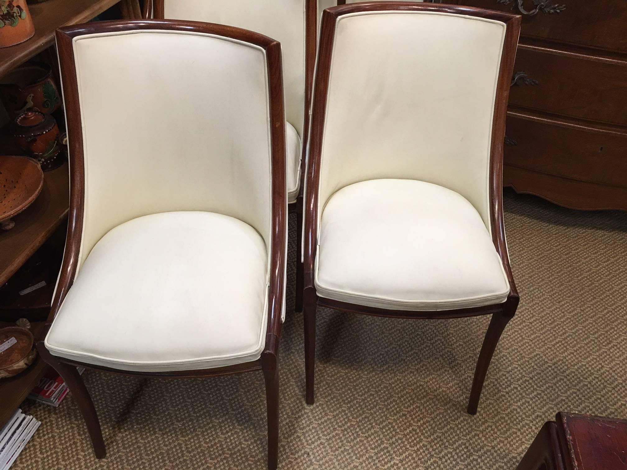 Set of chairs with down swept sides and sabre legs. Seat height-18.5