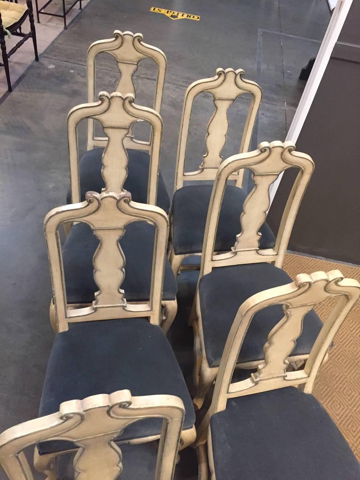 Set of painted chairs with a gray/green accent.