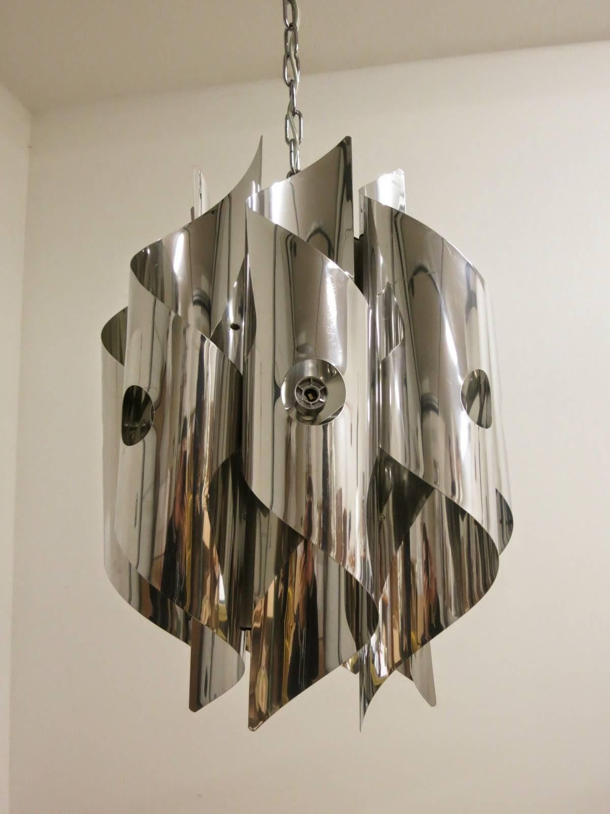 Vintage Italian pendant with 8 chrome chrome spirals / Designed by Sciolari circa 1970’s / Made in Italy
8 lights / E12 or E14 type / max 40W each
Diameter: 16 inches / Height: 22 inches plus chain and canopy
1 in stock in Palm Springs currently ON