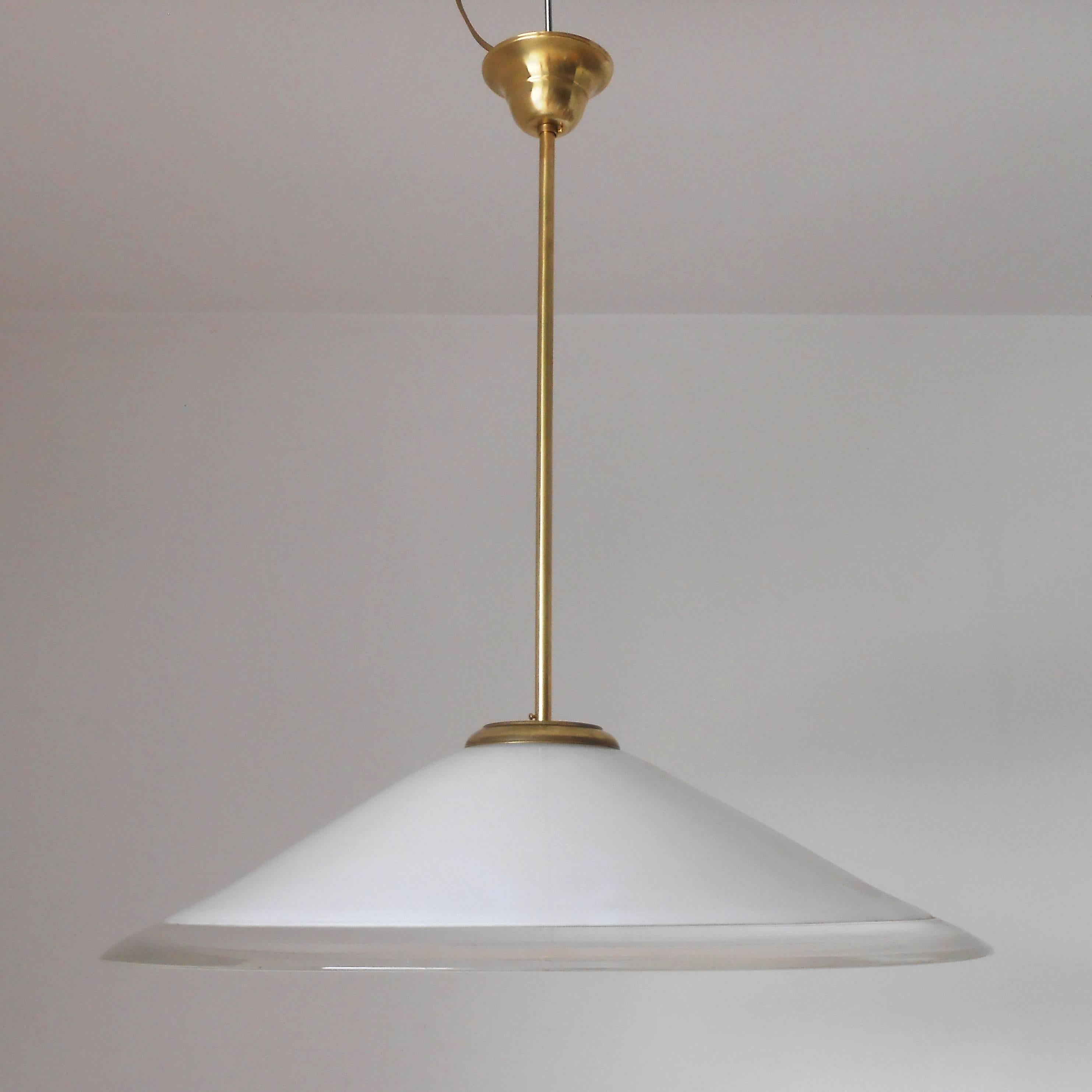 Vintage Italian pendant with white and clear Murano glass shade, mounted on brass hardware / Original sticker on the glass / Designed by Leucos circa 1960’s / Made in Italy
1 light / E26 or E27 type / max 60W 
Diameter: 25.5 inches / Height: 30
