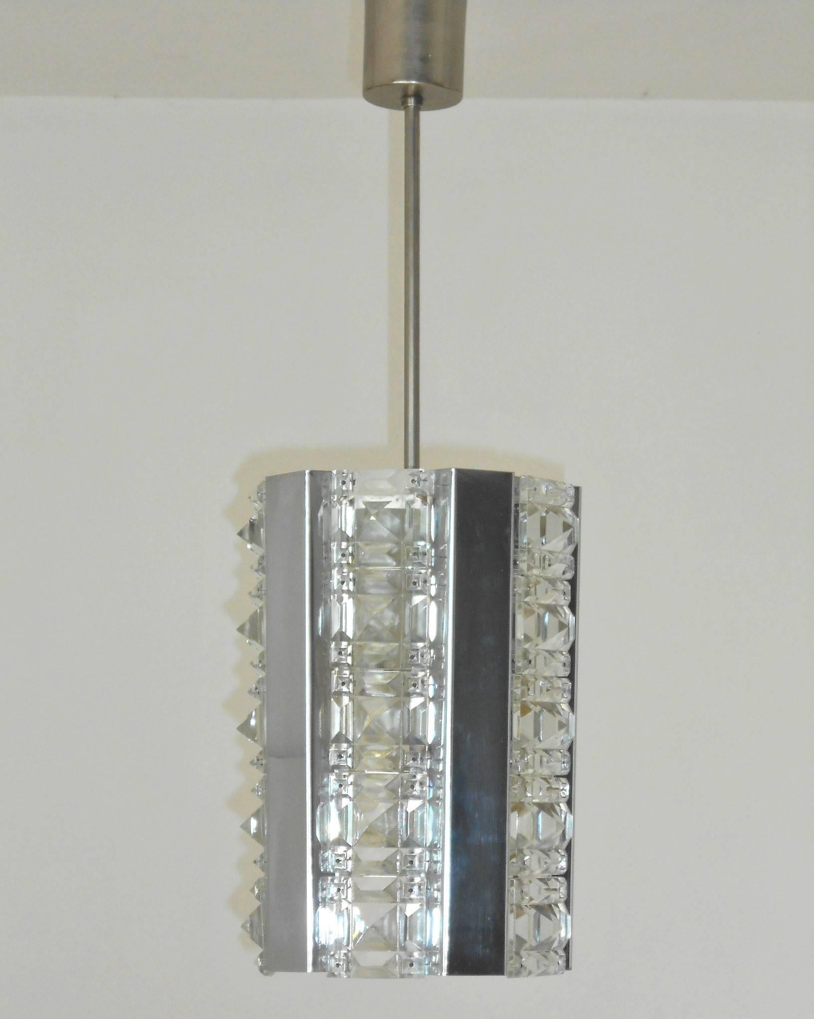 Vintage Italian pendant with faceted crystals with pyramid like designs and chrome details / Made in Italy circa 1960’s
1 light / E26 or E27 type / max 60W
Height: 25.5 inches including rod and canopy / Diameter: 8 inches 
1 in stock in Palm Spring