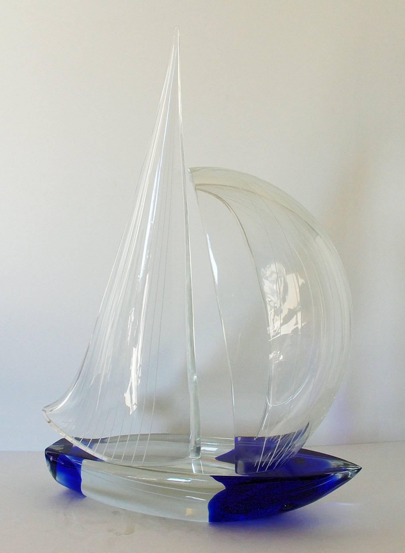 Vintage Italian double sail boat hand blown and crafted in clear and dark blue Murano glass by Alberto Dona'
Signed “Alberto Dona” on the base / Made in Italy in the 1980’s 
Height: 22 inches / Width: 17 inches / Depth: 7 inches 
1 in stock in Palm