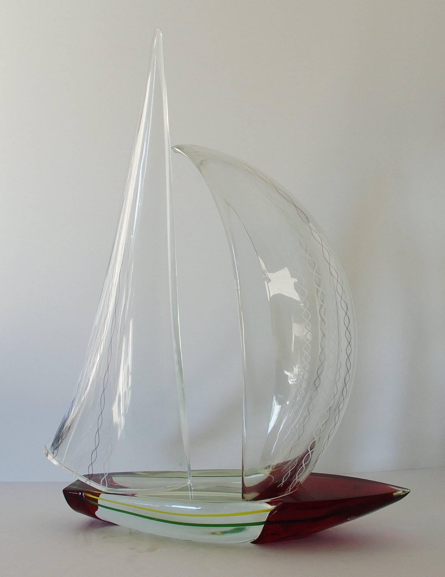 Vintage Italian double sail boat hand blown and crafted in clear and dark red Murano glass by Alberto Dona'
Signed “Alberto Dona” on the base / Made in Italy in the 1980’s 
Height: 22 inches / Width: 18 inches / Depth: 7 inches 
1 in stock in Palm