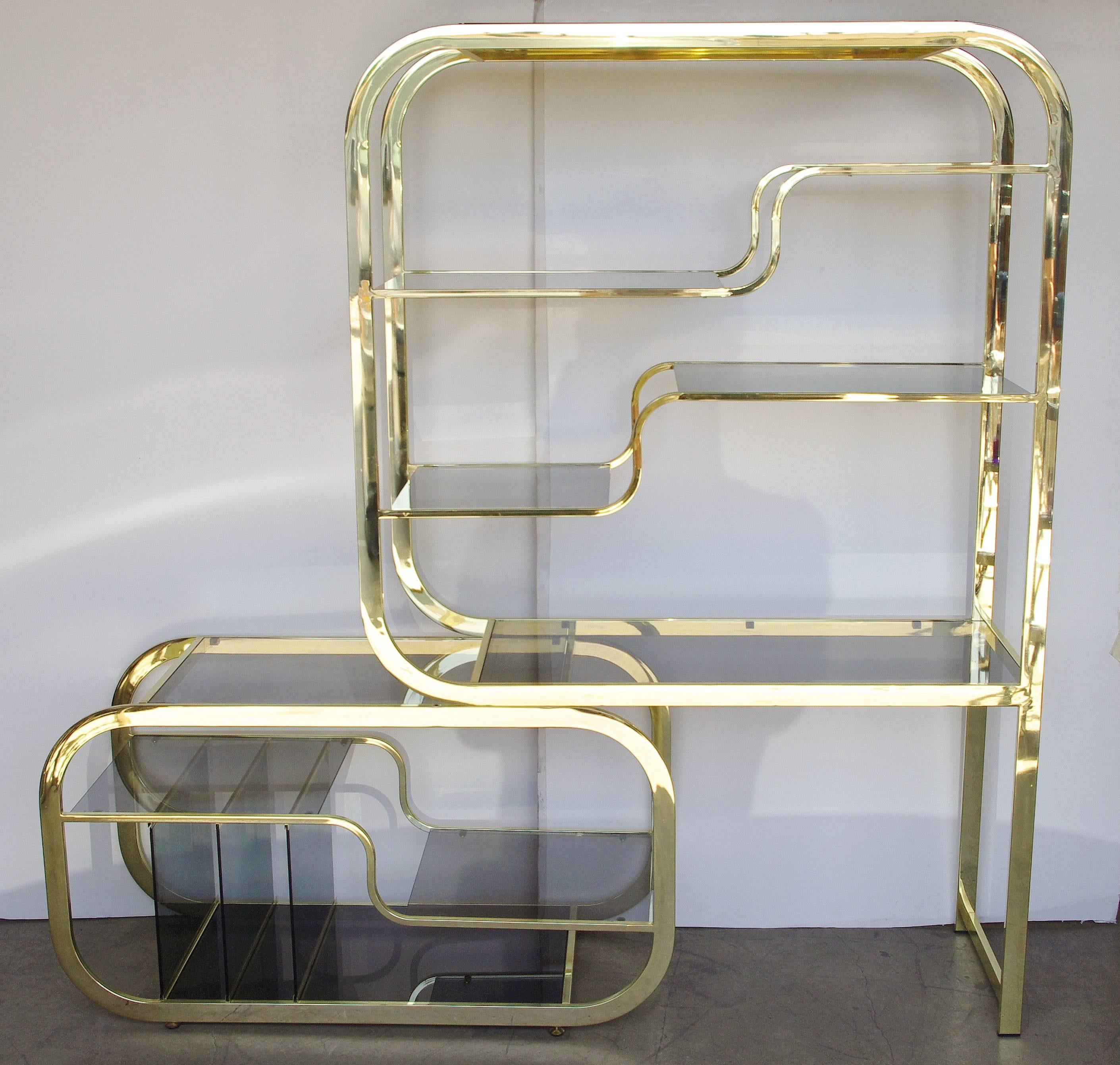 Stunning brass etagere by Milo Baughman for The Design Institute of America. The bottom expands from 48