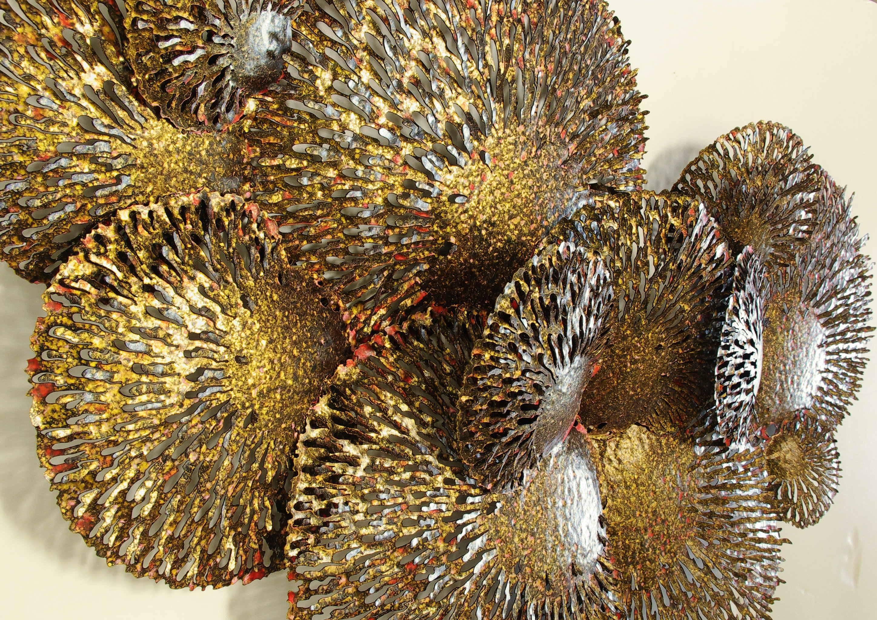 Gold and red iron coral wall sculpture.