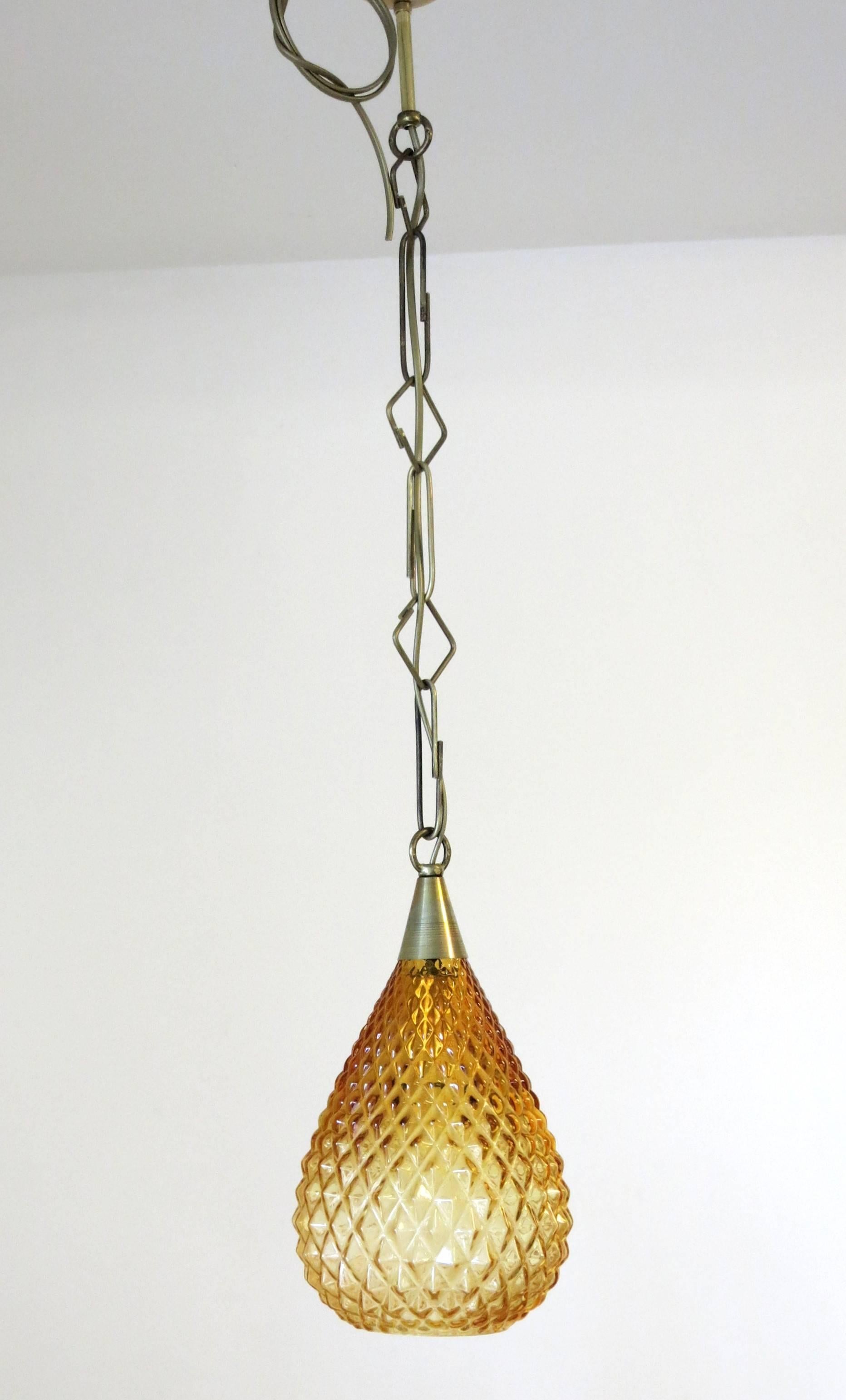 Italian pendant with amber Murano glass and diamond shaped details, mounted on brass frame / Designed by Fabio Bergomi for Fabio Ltd / Made in Italy 
1 light / E12 type / max 60W 
Height: 13 inches plus chain and canopy / Diameter: 7 inches
1 in