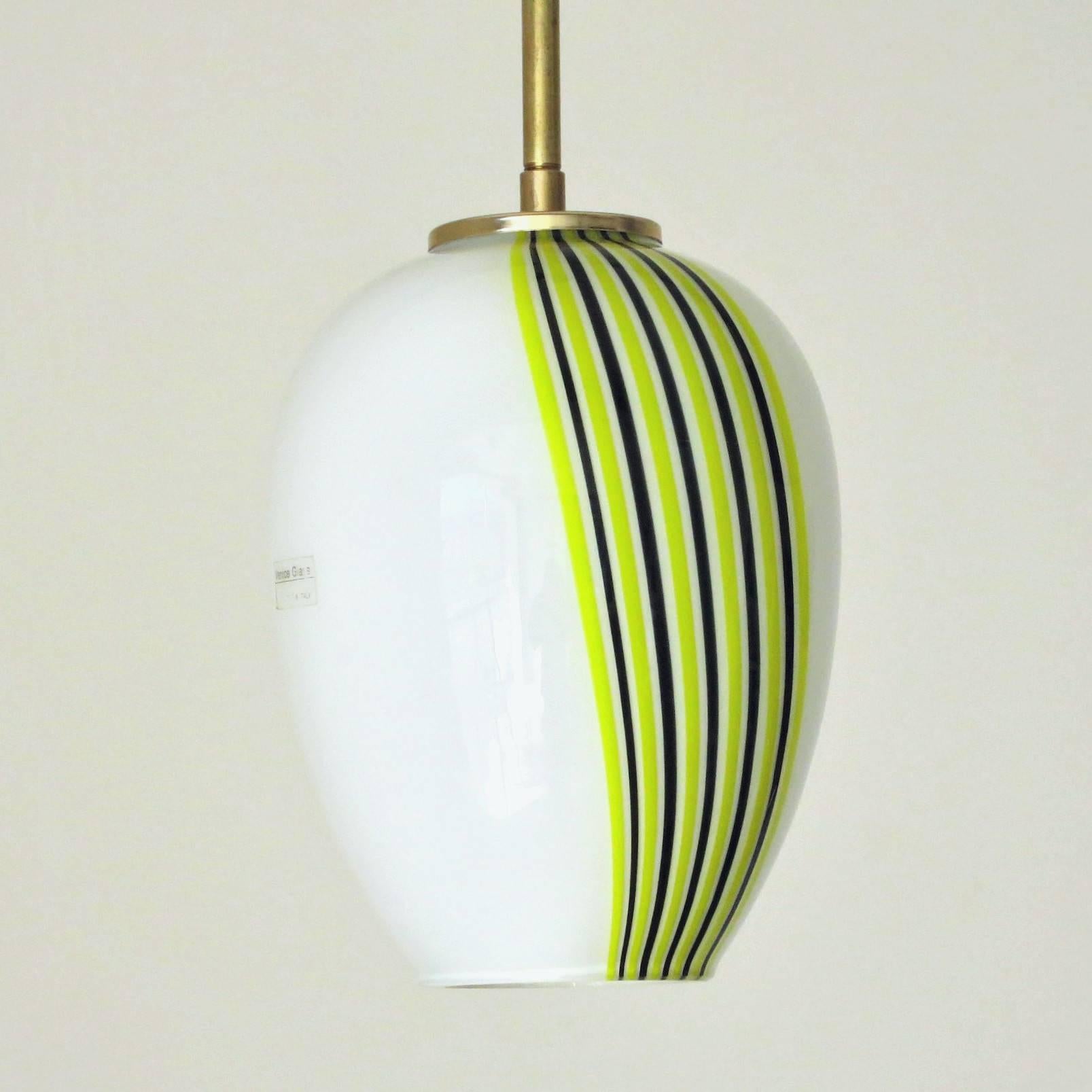 Vintage Italian pendant with white, green and black Murano glass delicately blown into a a single glass piece with striped design / Includes original sticker on the glass / Made in Italy circa 1960’s
1 light / E26 or E27 type / max 60W
Diameter: 6