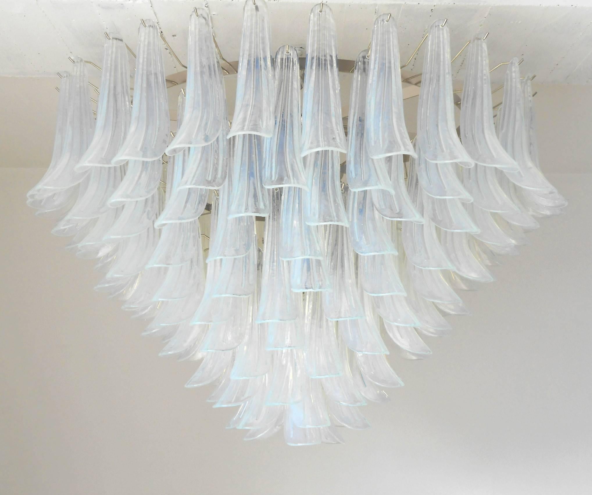 Italian chandelier with opaline Murano glasses hand blown into beautiful small saddles or leaves, mounted on nickel frame by Fabio Ltd / Made in Italy
21 lights / E26 or E27 type / max 60W each
Diameter: 47 inches / Height: 32 inches plus chain and