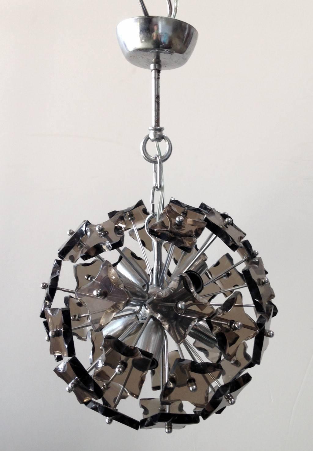 Vintage Italian sputnik chandelier with smoky faceted glasses, mounted on chrome frame / In the style of of Fontana Arte / Made in Italy circa 1960’s
8 lights / E14 type / max 40W each
Diameter: 13 inches plus chain and canopy
1 in stock in Palm