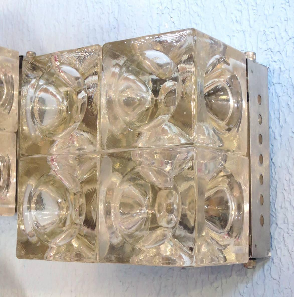 Vintage Italian wall lights or flush mounts with clear Murano glass cubes with indented pattern mounted on nickel back plates / Designed by Poliarte, circa 1960s / Made in Italy
2 lights / E12 or E14 type / max 40W each
Height: 6.5 inches / Width:
