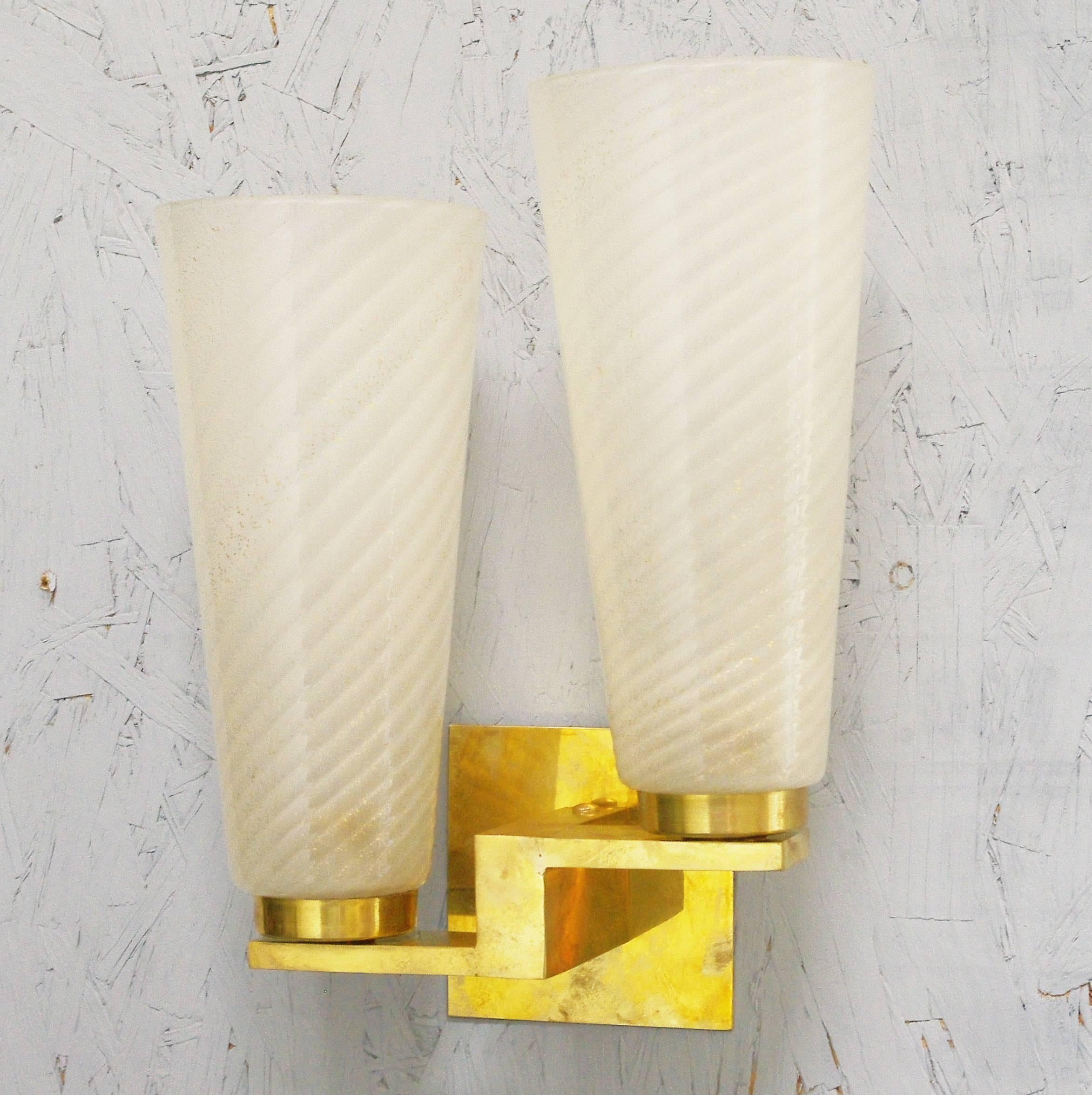 Limited edition Italian wall lights with cylinder-shaped hand blown frosted gold infused Murano glasses mounted on solid brass frames / Designed by Fabio Bergomi / Made in Italy
2 lights / E12 or E14 type / max 40W each
Height: 13 inches / Width: 10