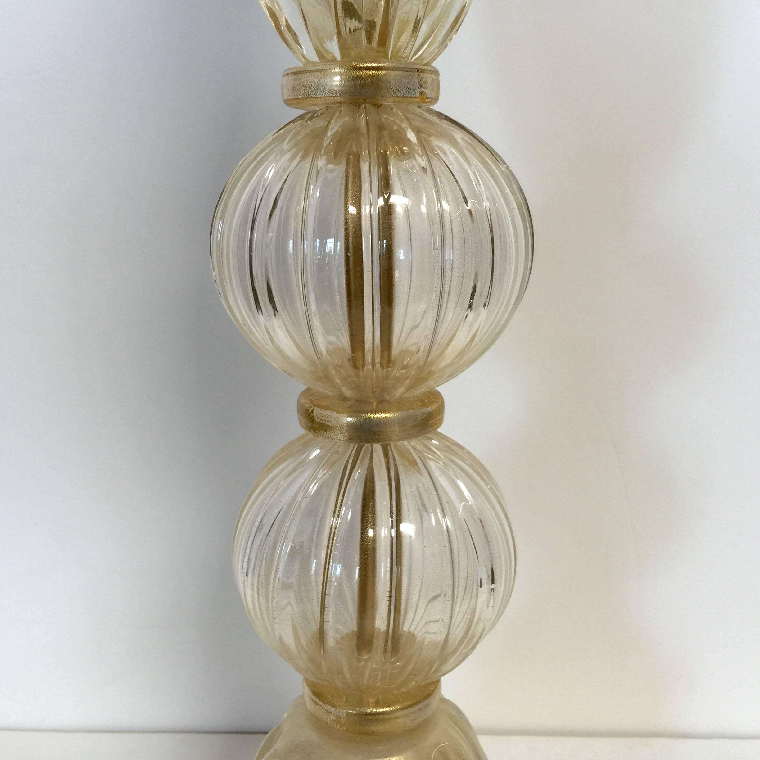 Pair of vintage Italian table lamps with gold infused Murano glass / Made in Italy in the 1960's
1 light / E26 or E27 type / max 60W
Height: 25.5 inches / Diameter: 7.5 inches 
1 pair in stock in Palm Springs ON FINAL CLEARANCE SALE for $1,599 for