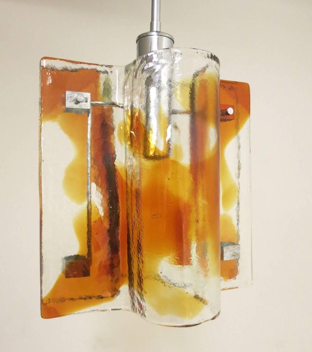 Vintage Italian pendant with hand blown infused clear and amber Murano glass panels, mounted on chrome frame / Designed by Mazzega circa 1960’s / Made in Italy
1 light / E26 or E27 type / max 60W each
Diameter: 11.5 inches / Height: 30 inches