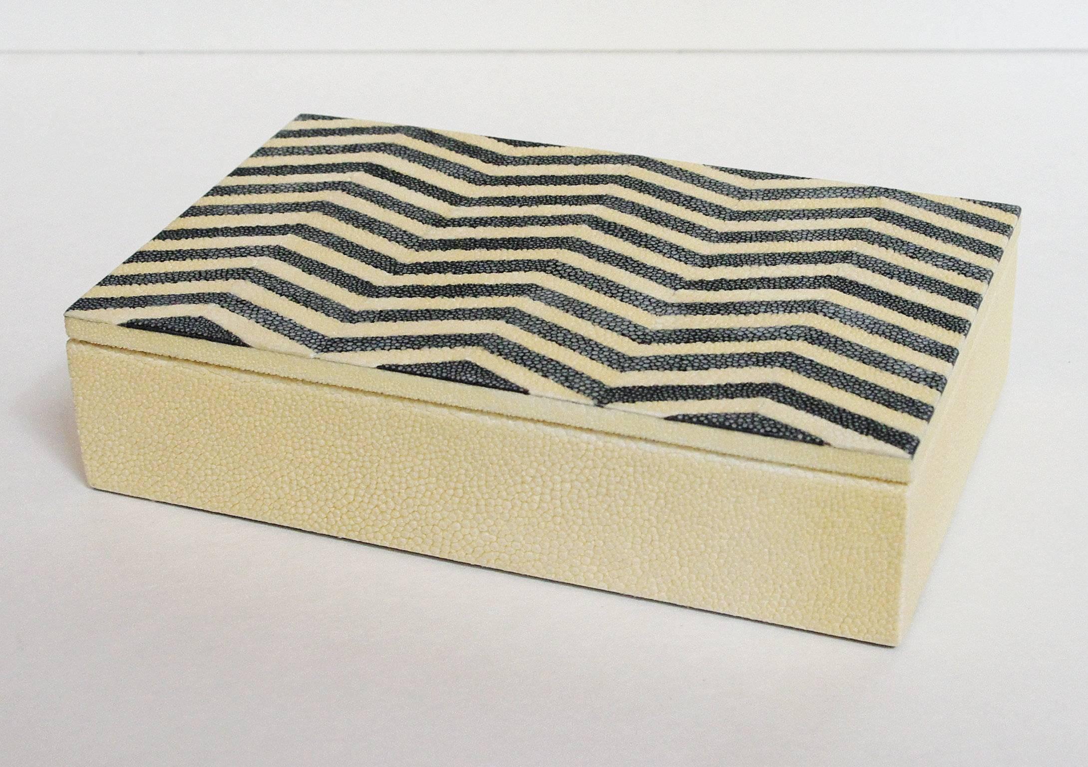 Ivory and black Shagreen box with zigzag pattern and gray suede interior
Depth: 5 inches / Width: 8 inches / Height: 2 inches
1 in stock in Palm Springs currently ON SALE for $699!!!
Order Reference #: MR19

This piece makes for great and unique