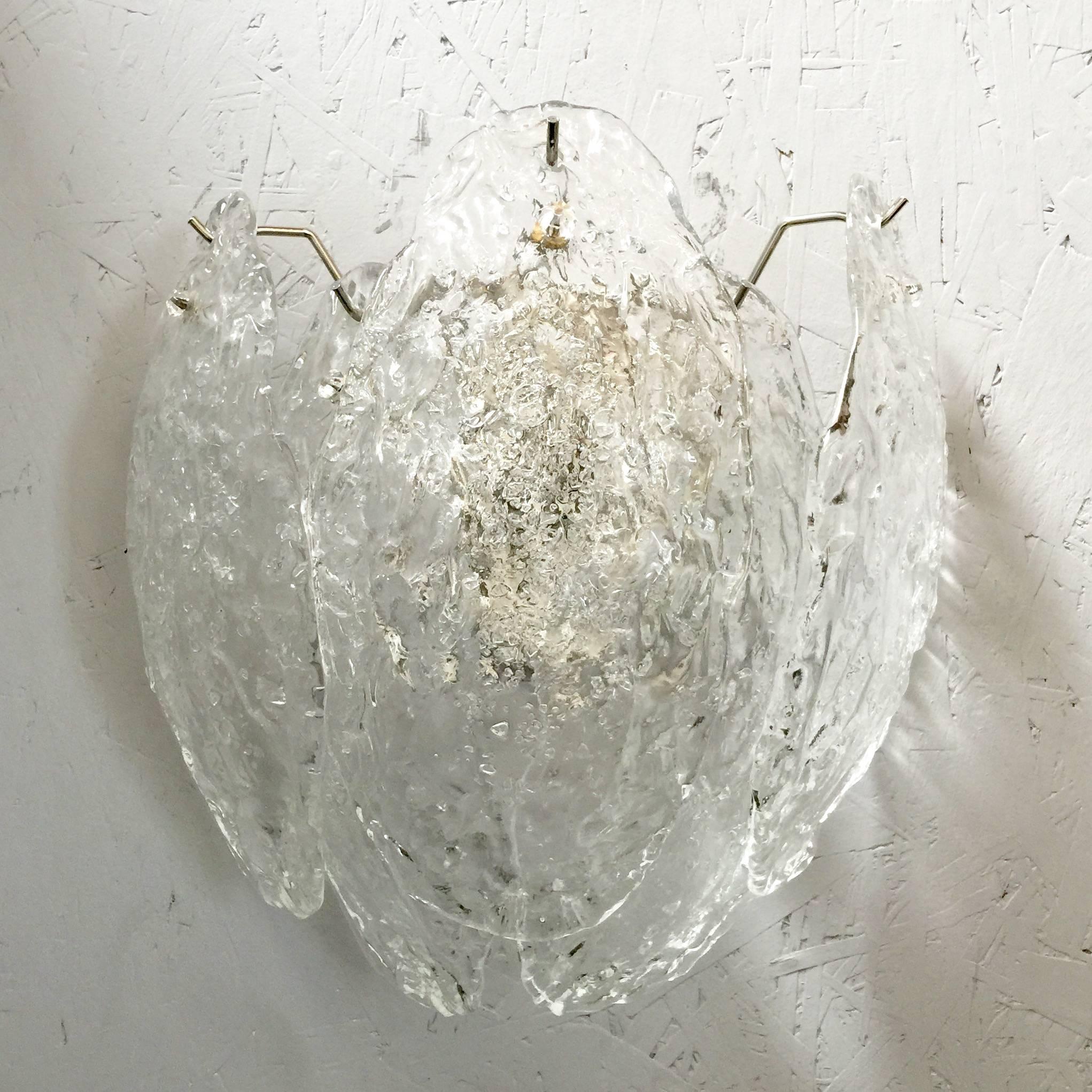 Vintage Italian wall lights with clear Murano glass leaves mounted on nickel frames / Designd by Mazzega, circa 1960s / Made in Italy
2 lights / E26 or E27 type / max 60W each 
Height: 13 inches /  Width: 13 inches / Depth: 7 inches
1 pair in stock