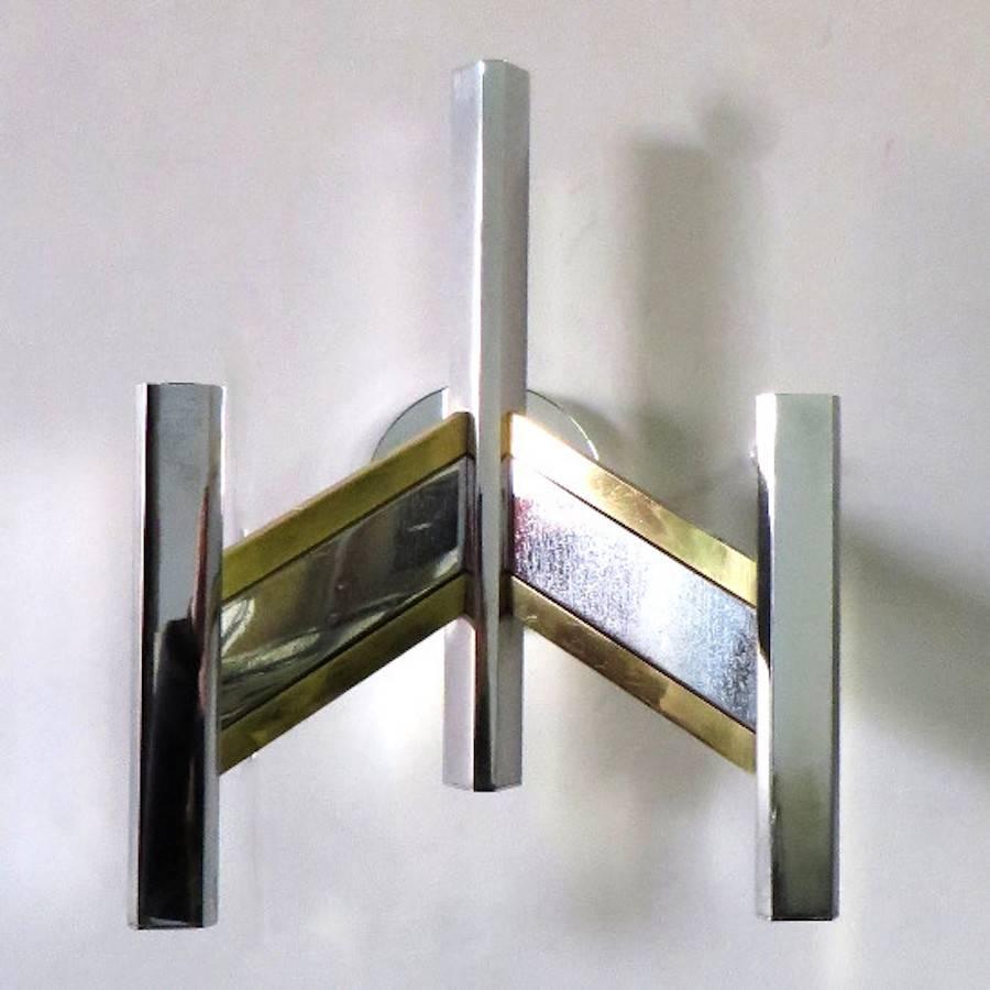 Vintage Italian wall lights with chrome frame and brass details / Designed by Sciolari, circa 1960s / Made in Italy
3 lights / E12 or E14 type / max 40W each
Height: 12 inches / Width: 16 inches / Depth: 7 inches
1 pair in stock in Palm Springs