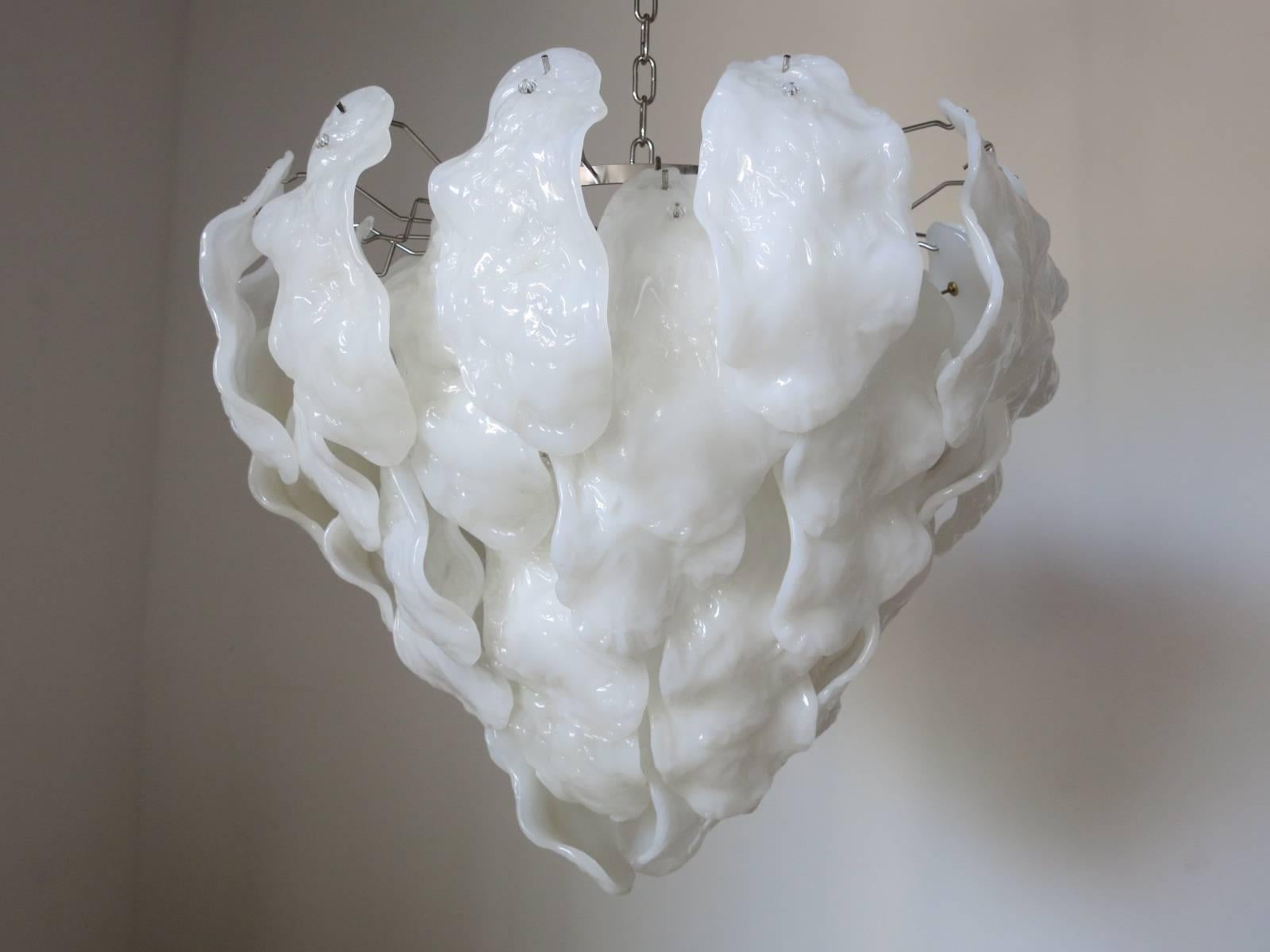 Italian milky Murano glass leaves chandelier by Mazzega.
Seven-light sockets; wired for the U.S.