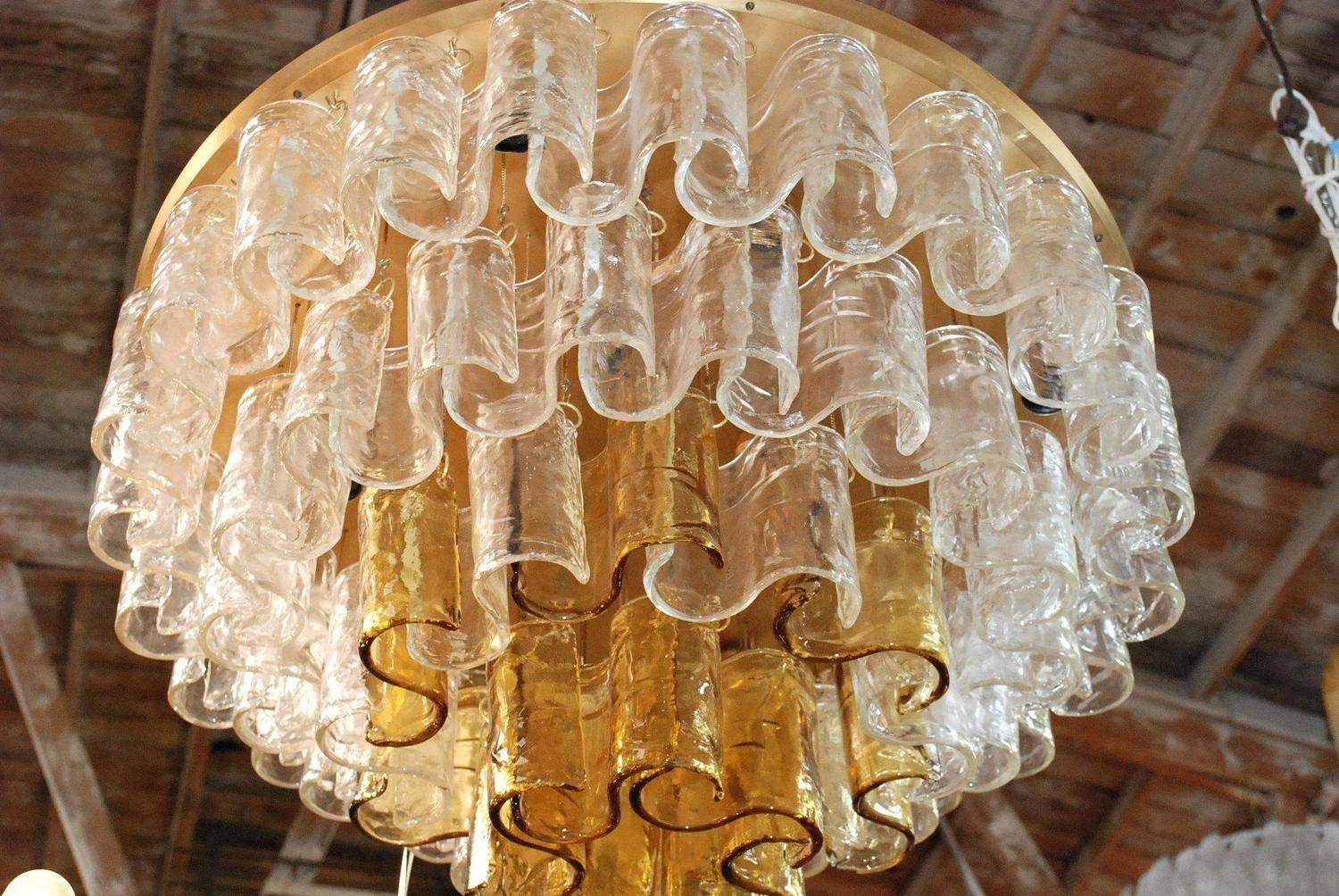 Italian clear and amber Murano waves glass chandelier by Mazzega.
Ten light sockets; wired for the U.S.