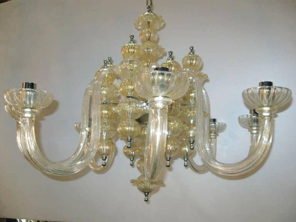 Italian traditional Murano glass chandelier with gold infused in the glass.
Eight light sockets; E14 fitting.
