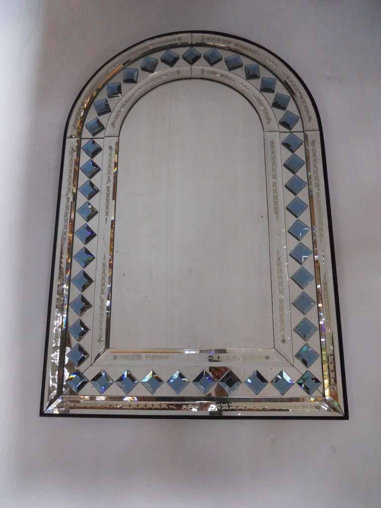 Vintage Mid-Century Italian arch shaped mirror, with blue diamond shaped glass decorations. / Made in Italy circa 1970's.
Height: 41.5 inches / Width: 27.5 inches / Depth: 1 inch
1 in stock in Palm Springs currently ON SALE for $4,999!!!
Order