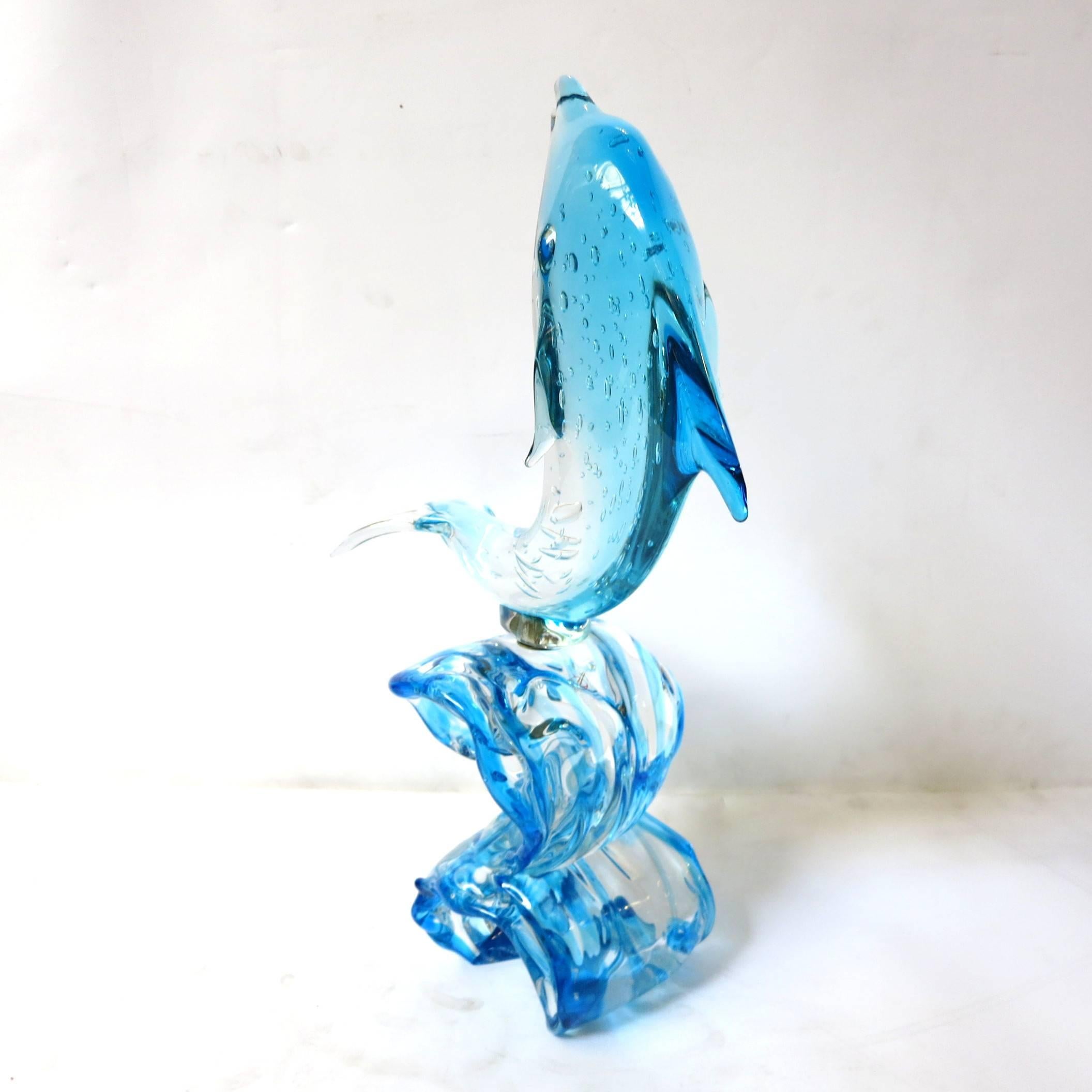 Italian sculpture of a dolphin on top of a wave, hand blown and crafted from clear and blue Murano glass by Sergio Costantini, signed on the base / Made in Italy in the 1980’s
Depth: 6 inches / Width: 14 inches / Height: 25.5 inches
Order Reference