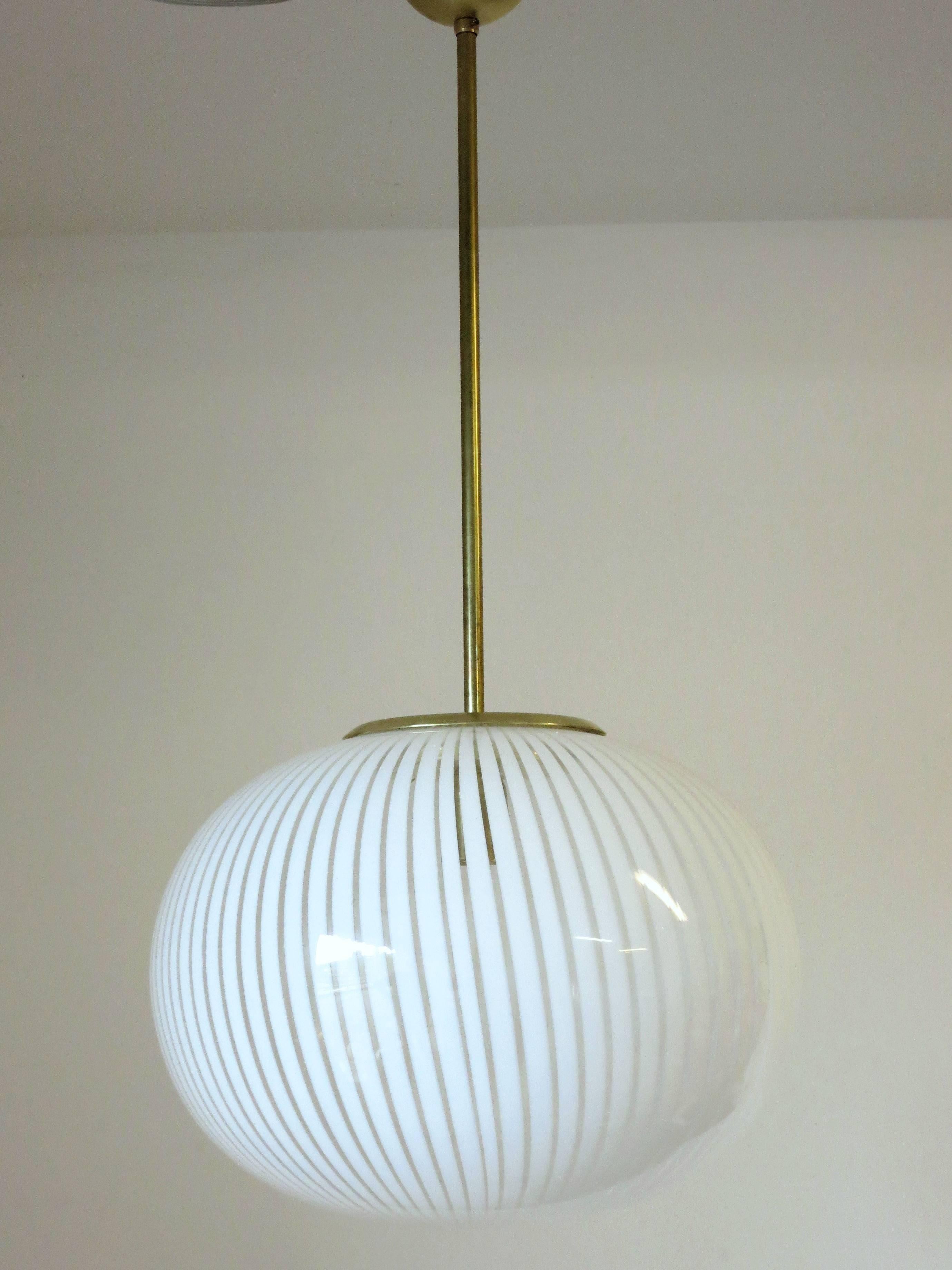 Italian Murano glass with white stripes pendant by Venini.
Single light socket ; wired for the U.S.