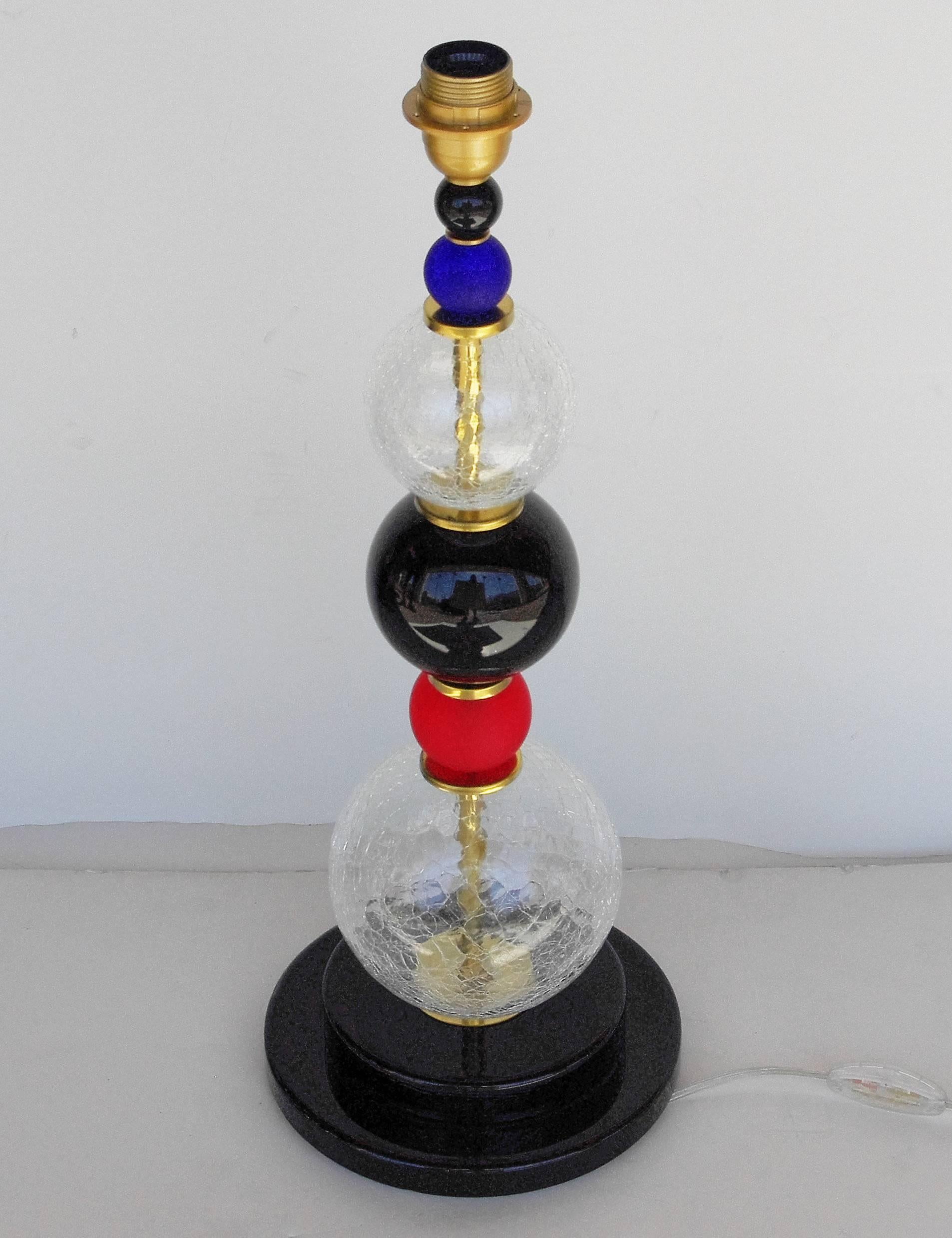 Italian Vintage table lamps with blue, clear, black and red Murano glass sphere details and brass frame, in the style of Ettore Sottsass. / Made in Italy in the 1980's
1 light / max 40W each
Diameter: 8 inches / Height: 23 inches
1 pair in stock in