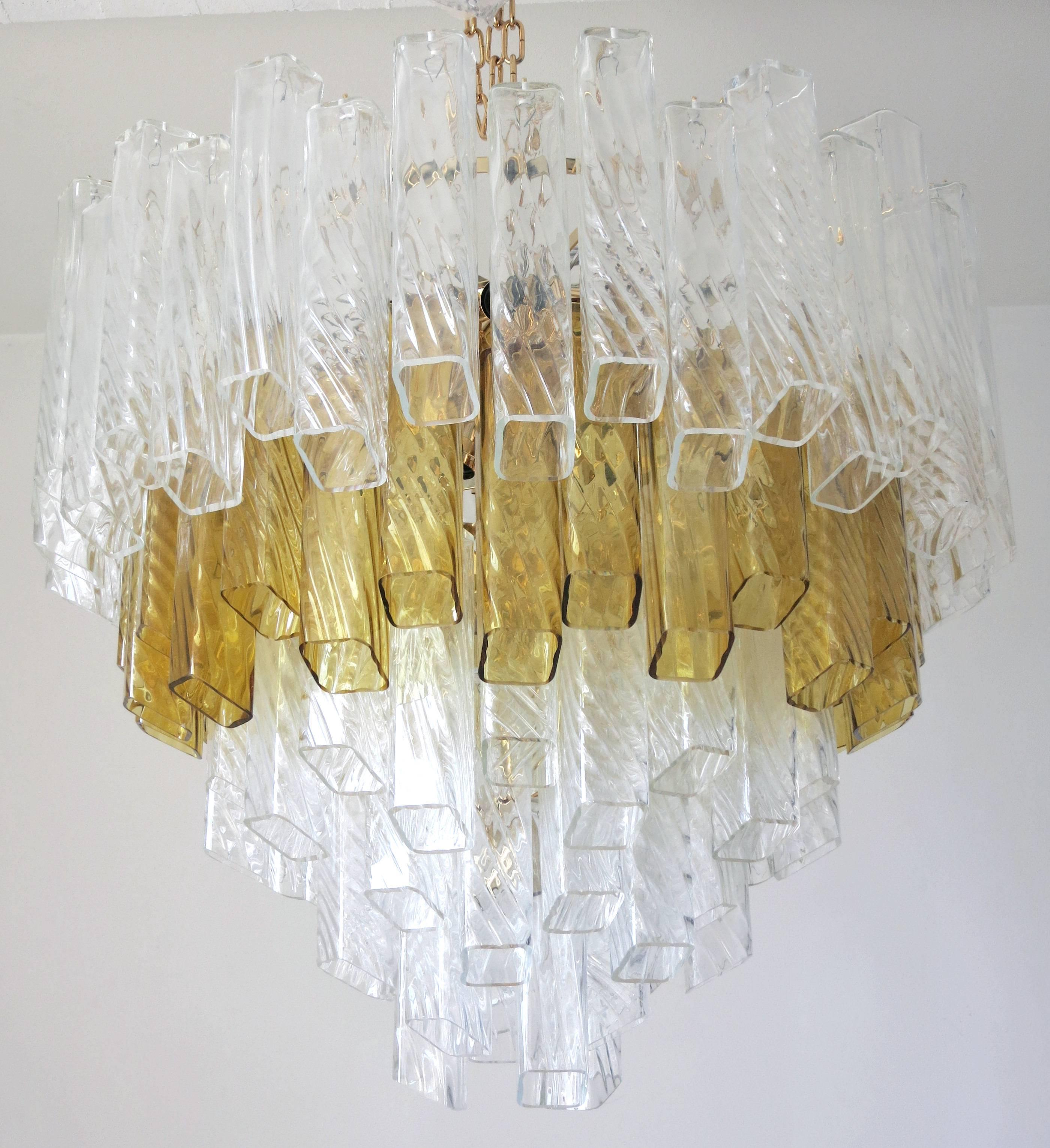 Italian Murano glass chandelier.
Vintage clear and amber handblown Murano glass pieces, on a newly made 24-karat gold-plated frame.
19-light sockets.

This item is located in Fabio Ltd warehouse in Italy.
Note: this item ships from Italy.
